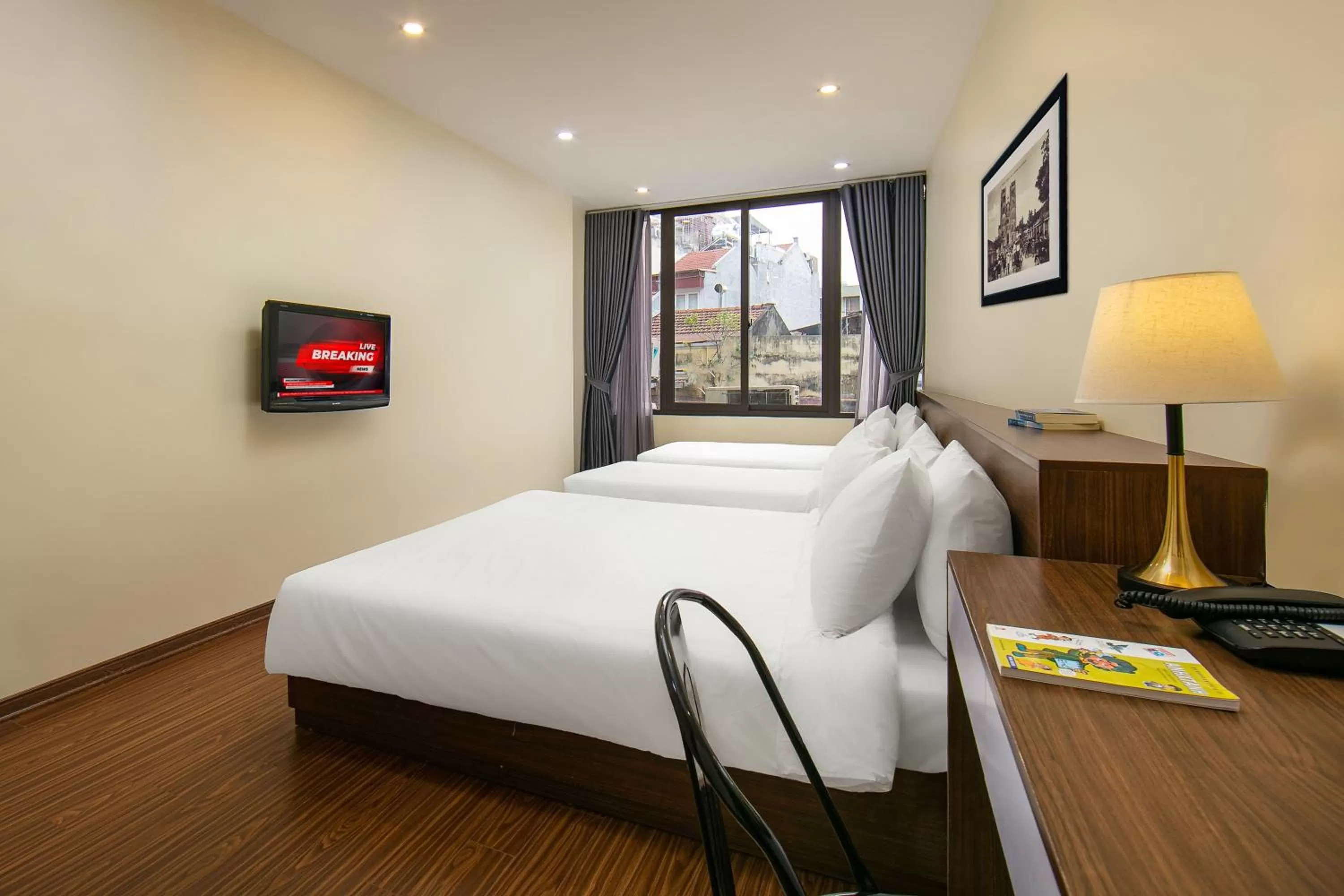 Premium Quadruple Room in Queen Cafe Hotel & Pub