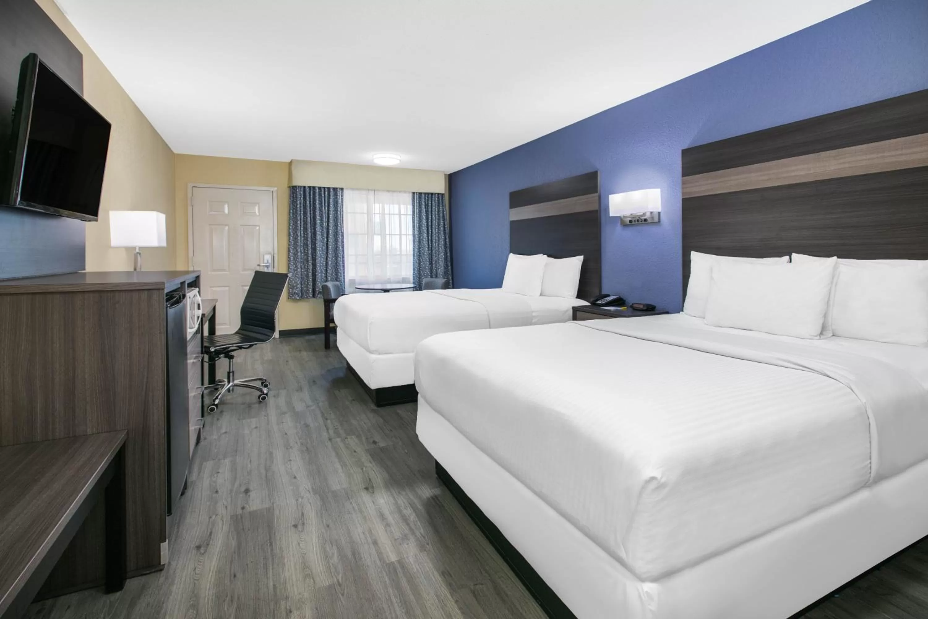 Queen Room with Two Queen Beds - Smoking in Days Inn by Wyndham Waco Near Downtown University