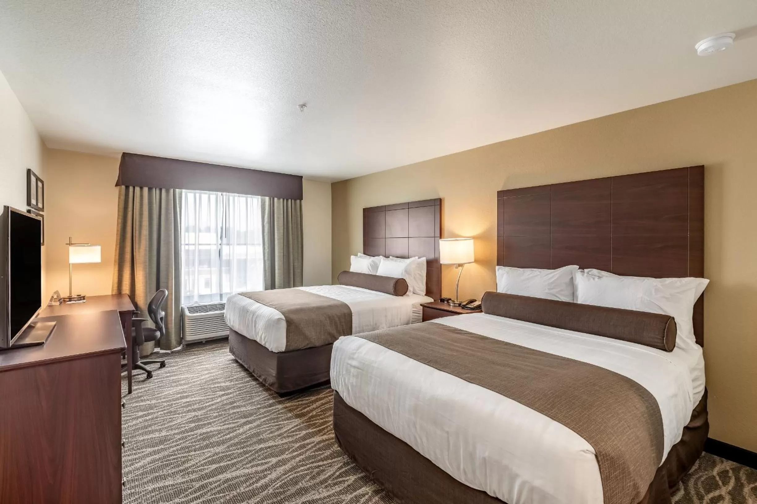 Queen Room with Two Queen Beds in Cobblestone Hotel & Suites - Stevens Point