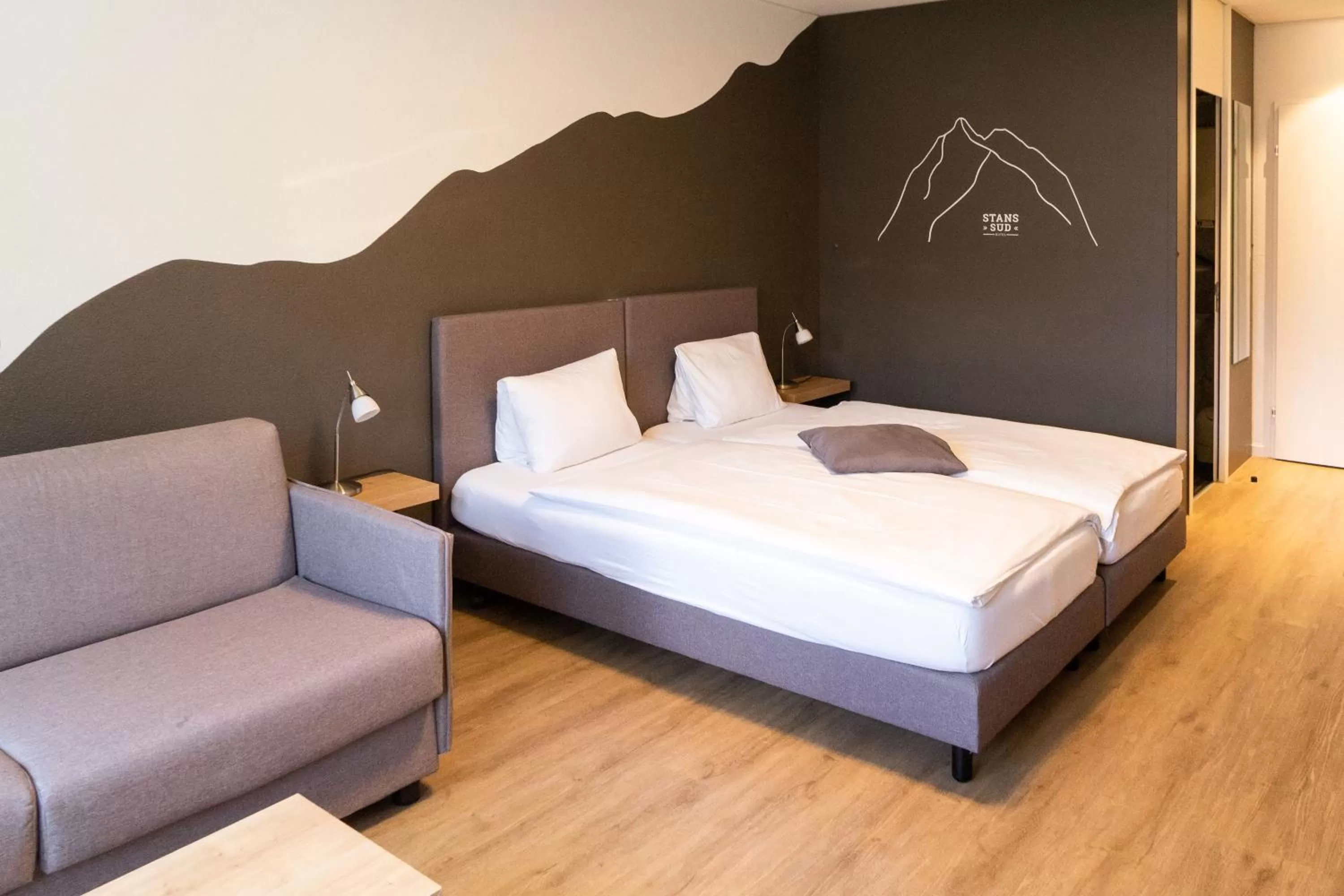 Superior Twin Room with Sofabed in Tailormade Hotel STANS SÜD