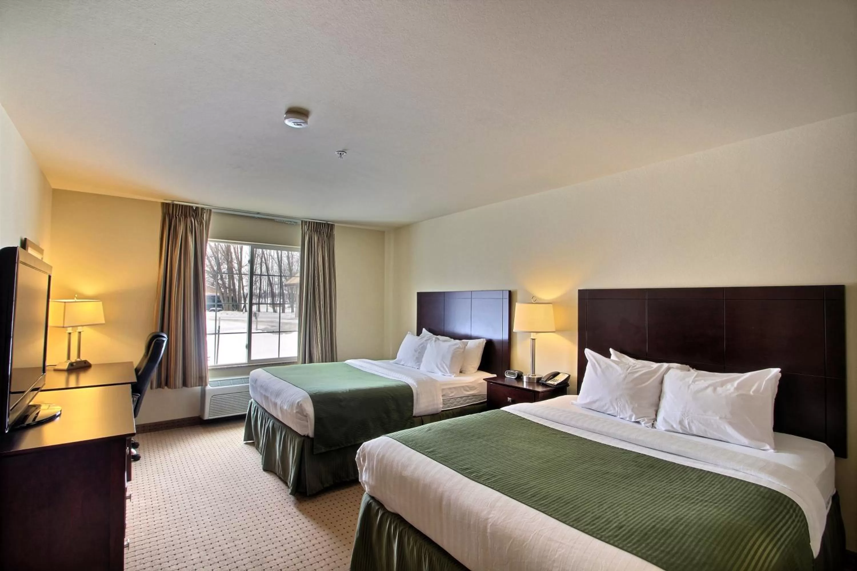 Queen Room with Two Queen Beds in Cobblestone Inn & Suites - Brillion