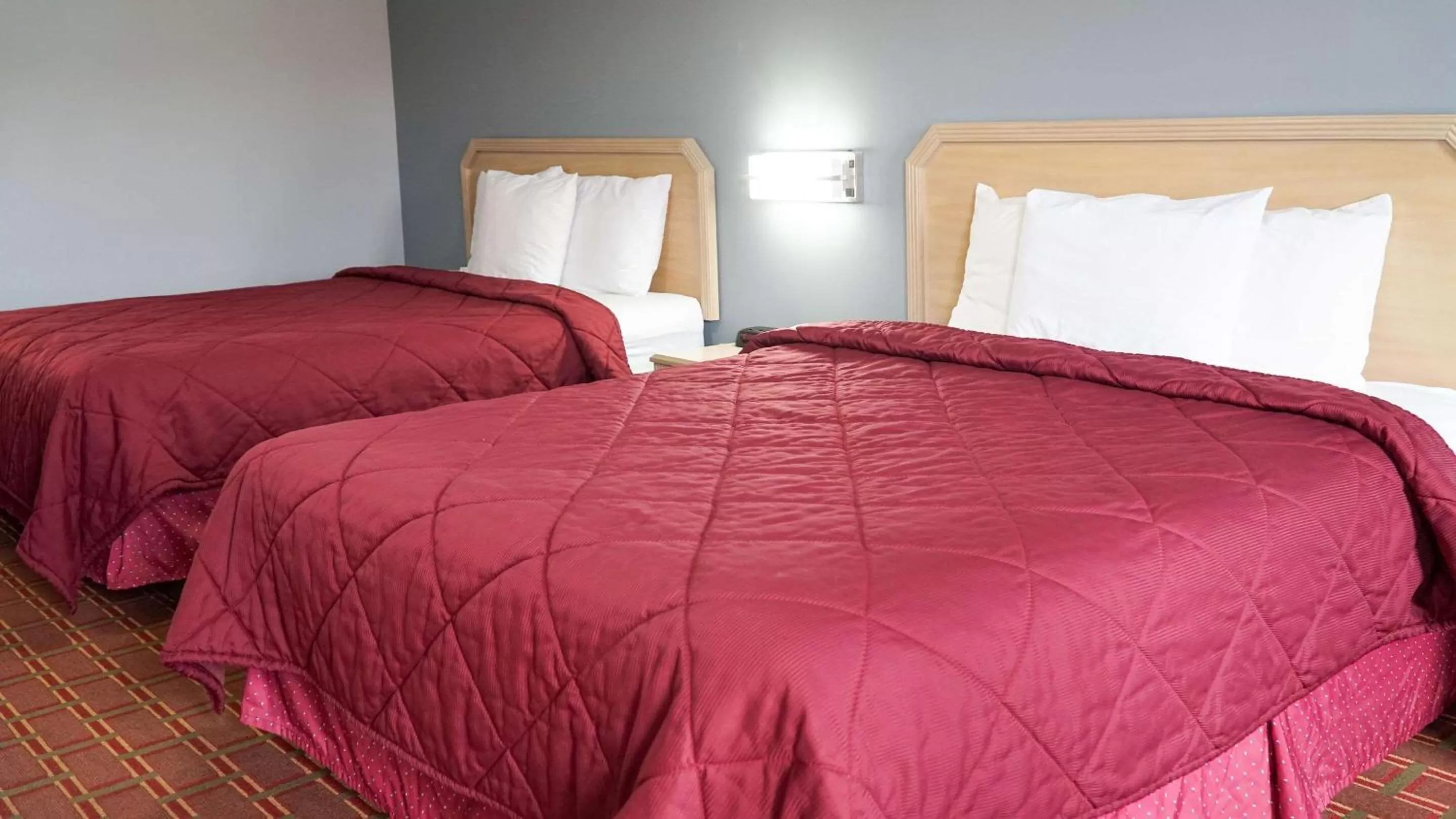 Queen Room with Two Queen Beds - Non-Smoking in Rodeway Inn
