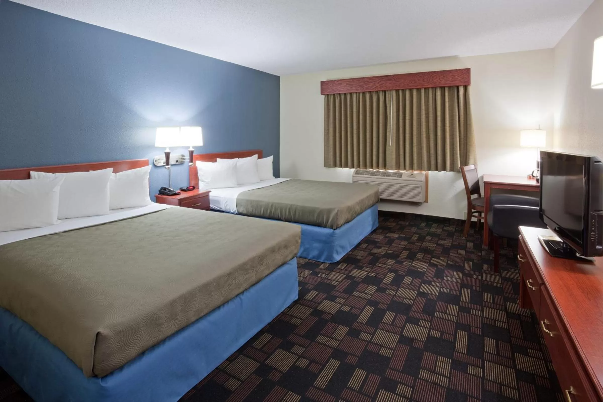 Deluxe Queen Room with Two Queen Beds - Non-Smoking in AmericInn by Wyndham Austin