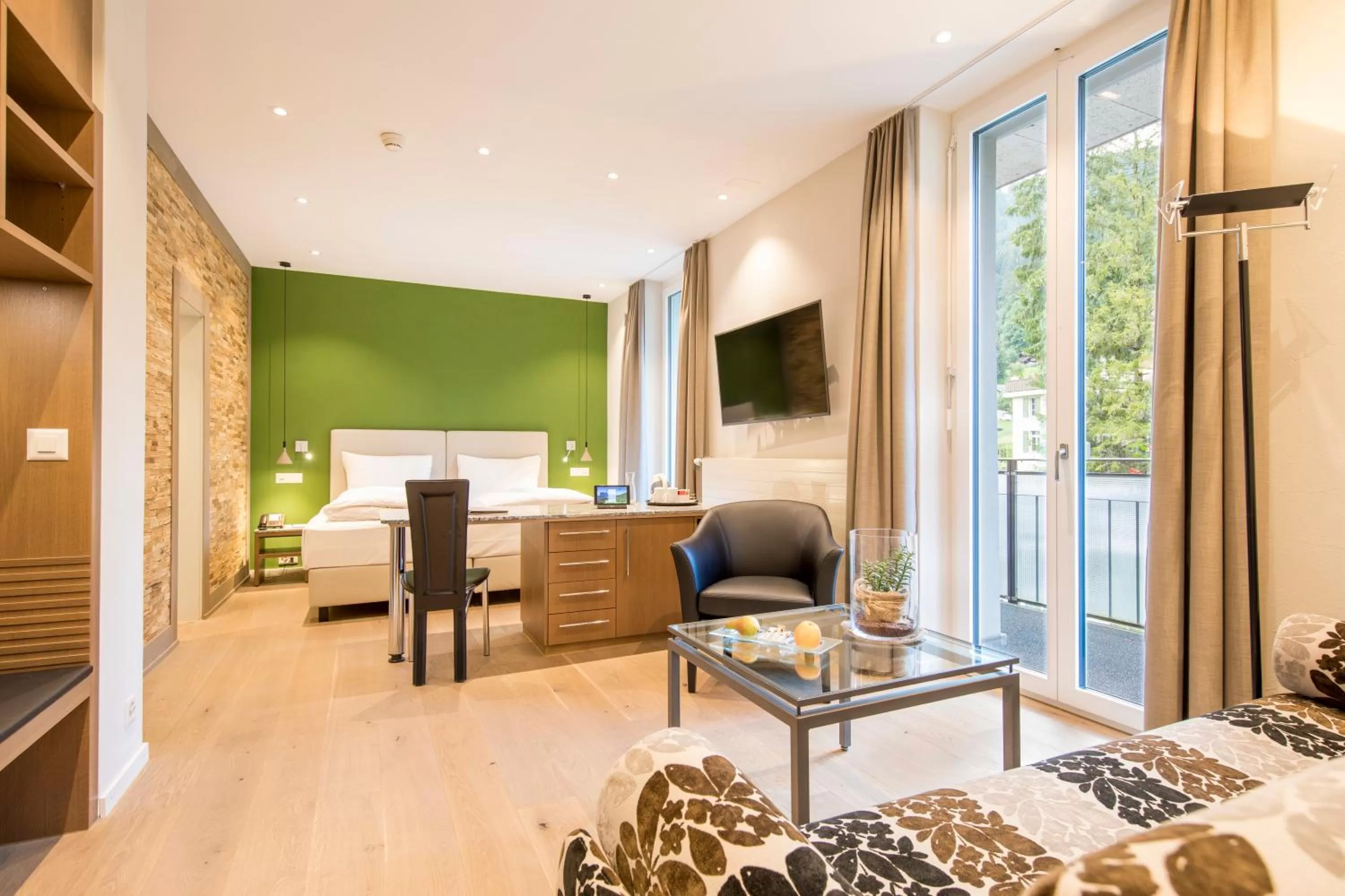 Family Room Mettenberg - Garden View with A/C in Belvedere Swiss Quality Hotel