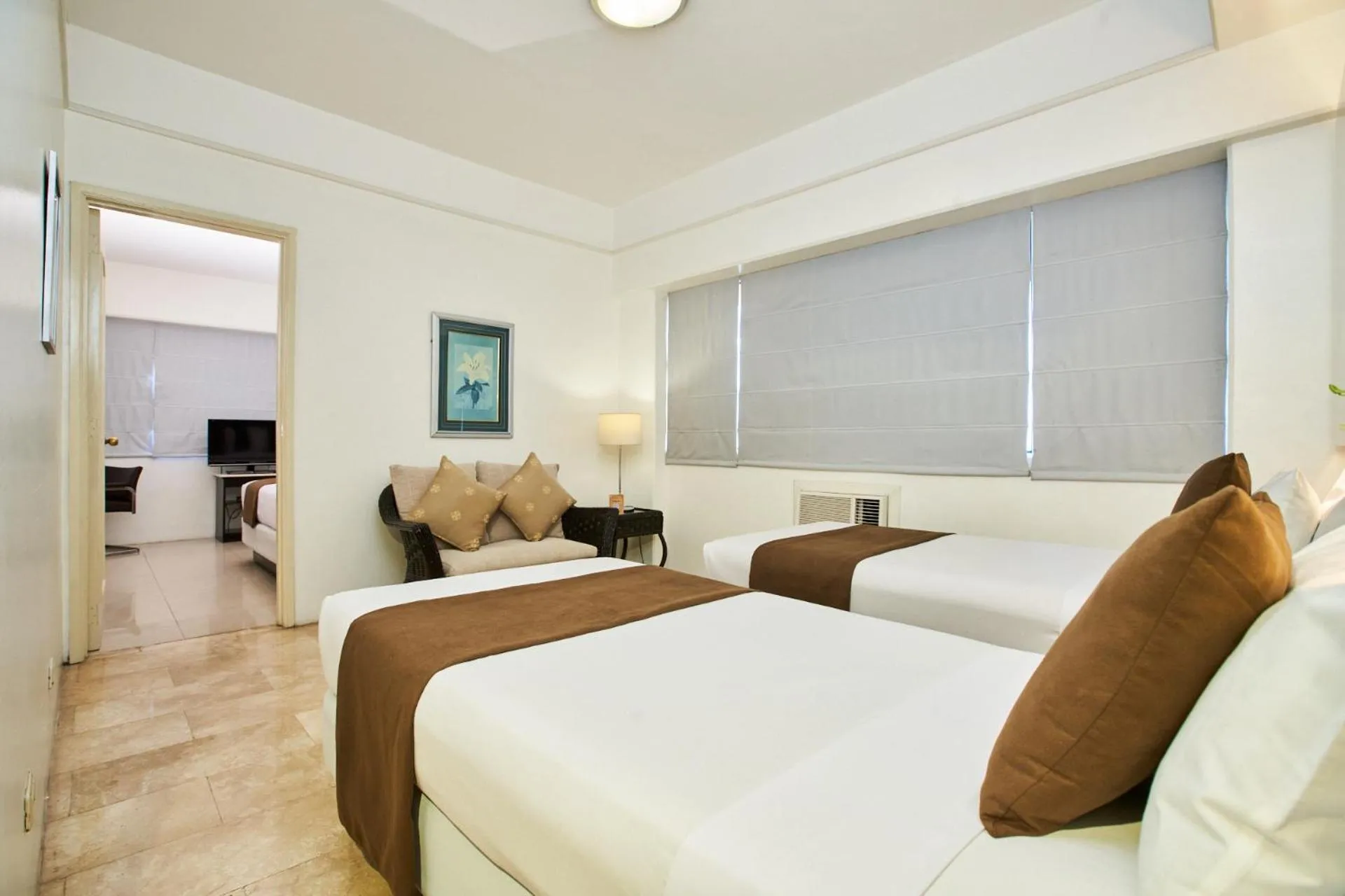 Deluxe Quadruple Room in Orchid Garden Suites