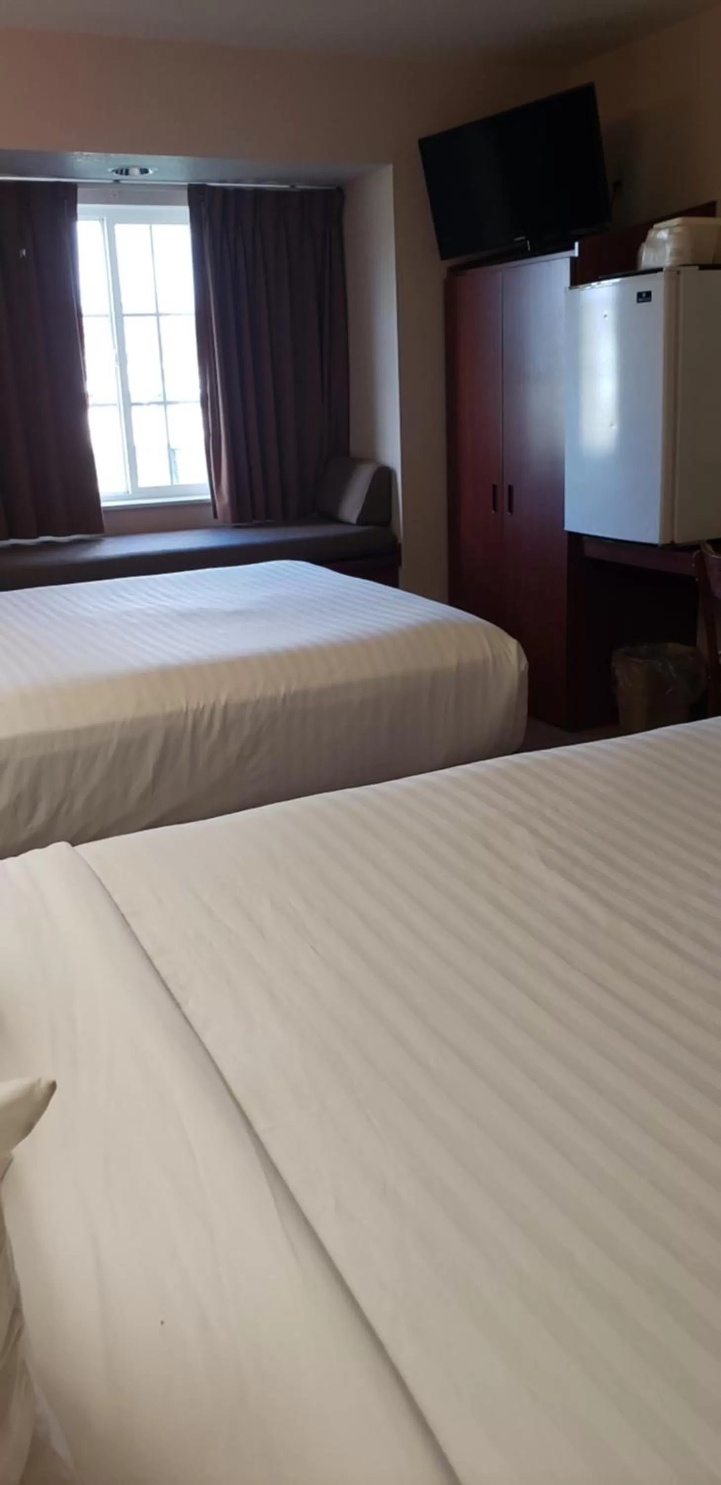Queen Room with Two Queen Beds and Roll-In Shower - Mobility/Hearing Accessible - Non-Smoking in Microtel Inn & Suites by Wyndham Wellsville