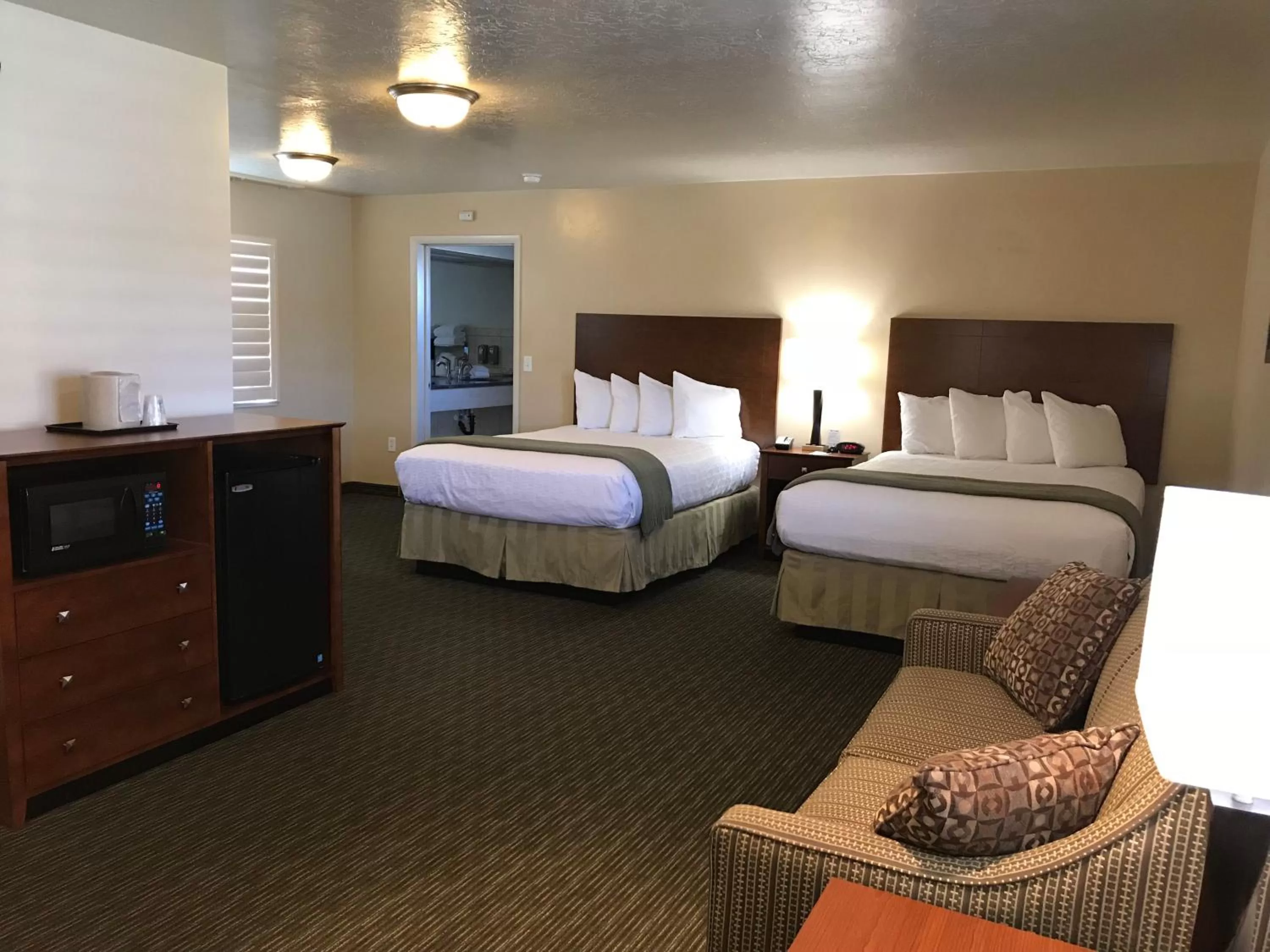 Two Queen Suite with Roll-In Shower - Non-Smoking/Disability Access in Dinosaur Inn & Suites
