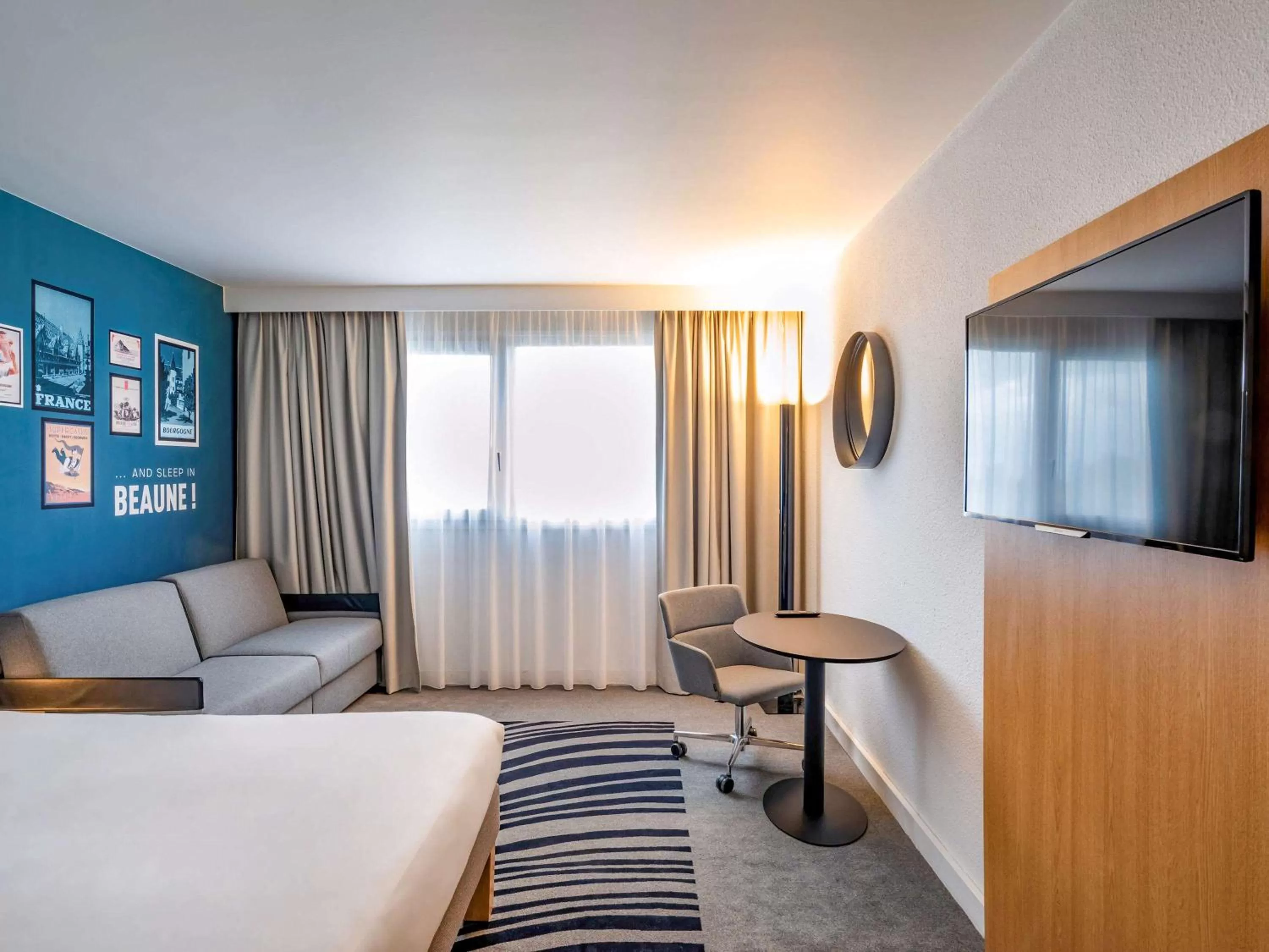 Classic Room with Double Bed and Two Single Sofa Beds in Novotel Beaune