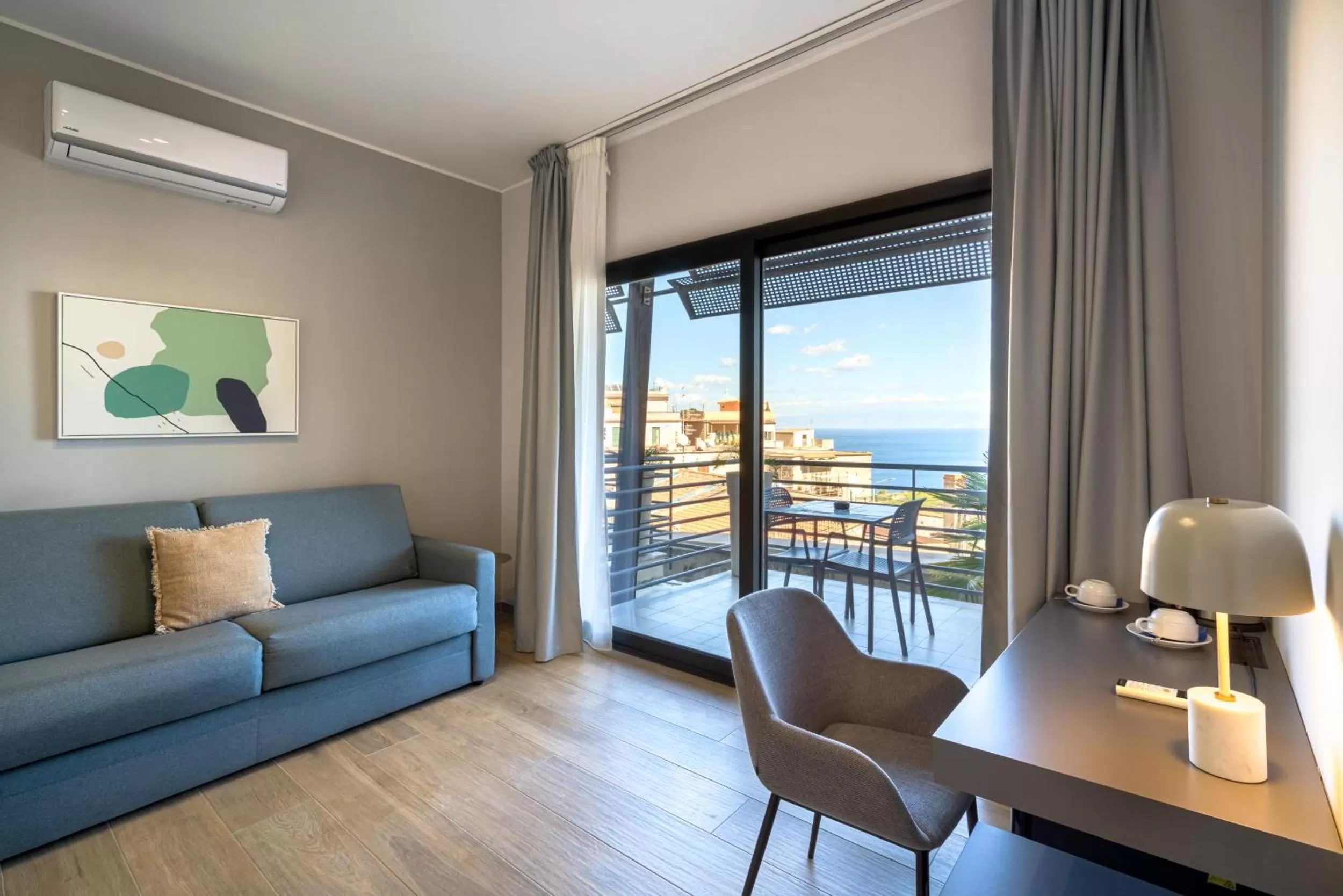 Family Room with Balcony and Partial Sea View in Taormina Palace Hotel