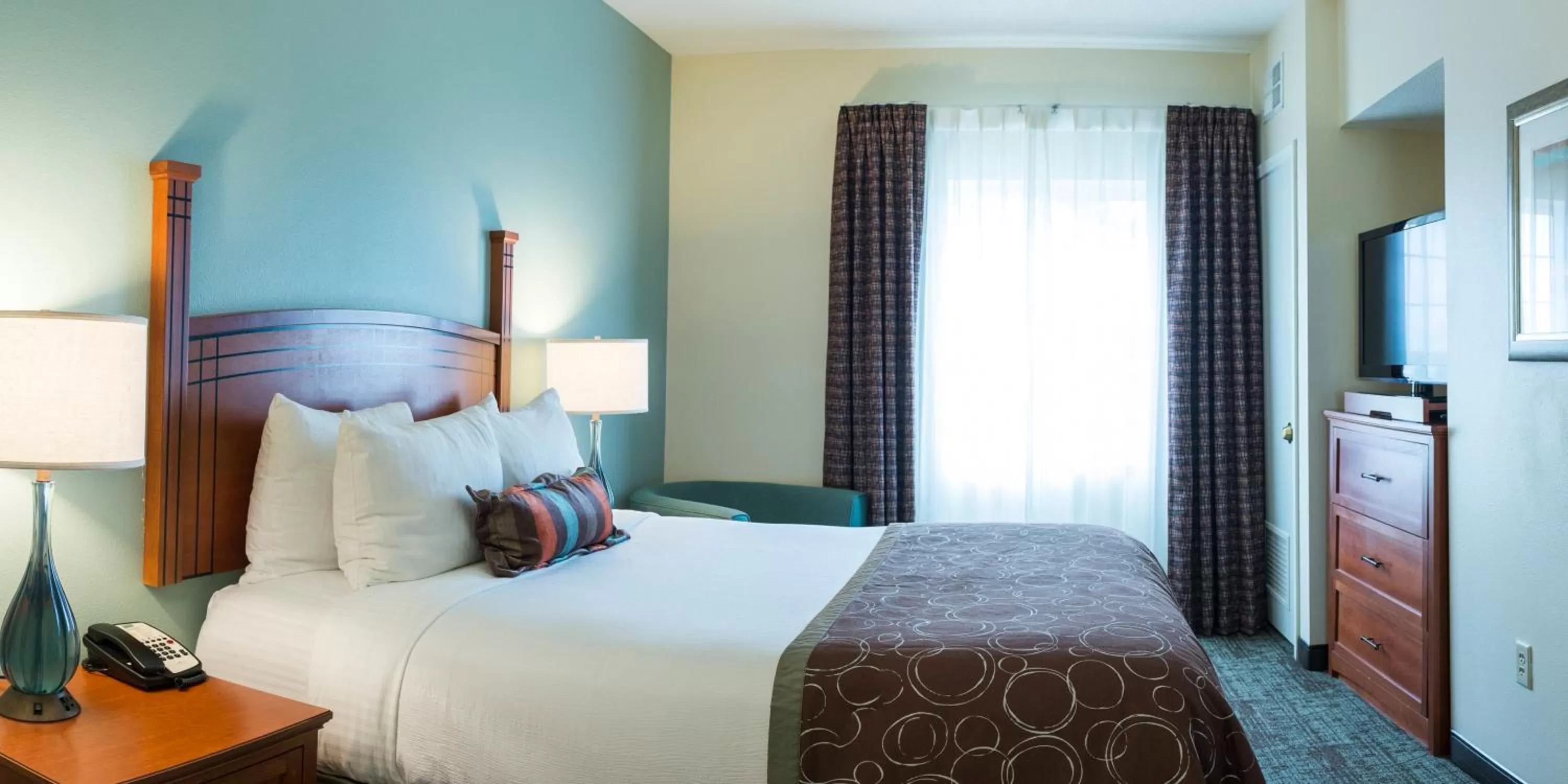 One Bedroom Suite with Queen Bed and Hearing Accessible Roll In Shower - Non-Smoking in Staybridge Suites Fargo by IHG