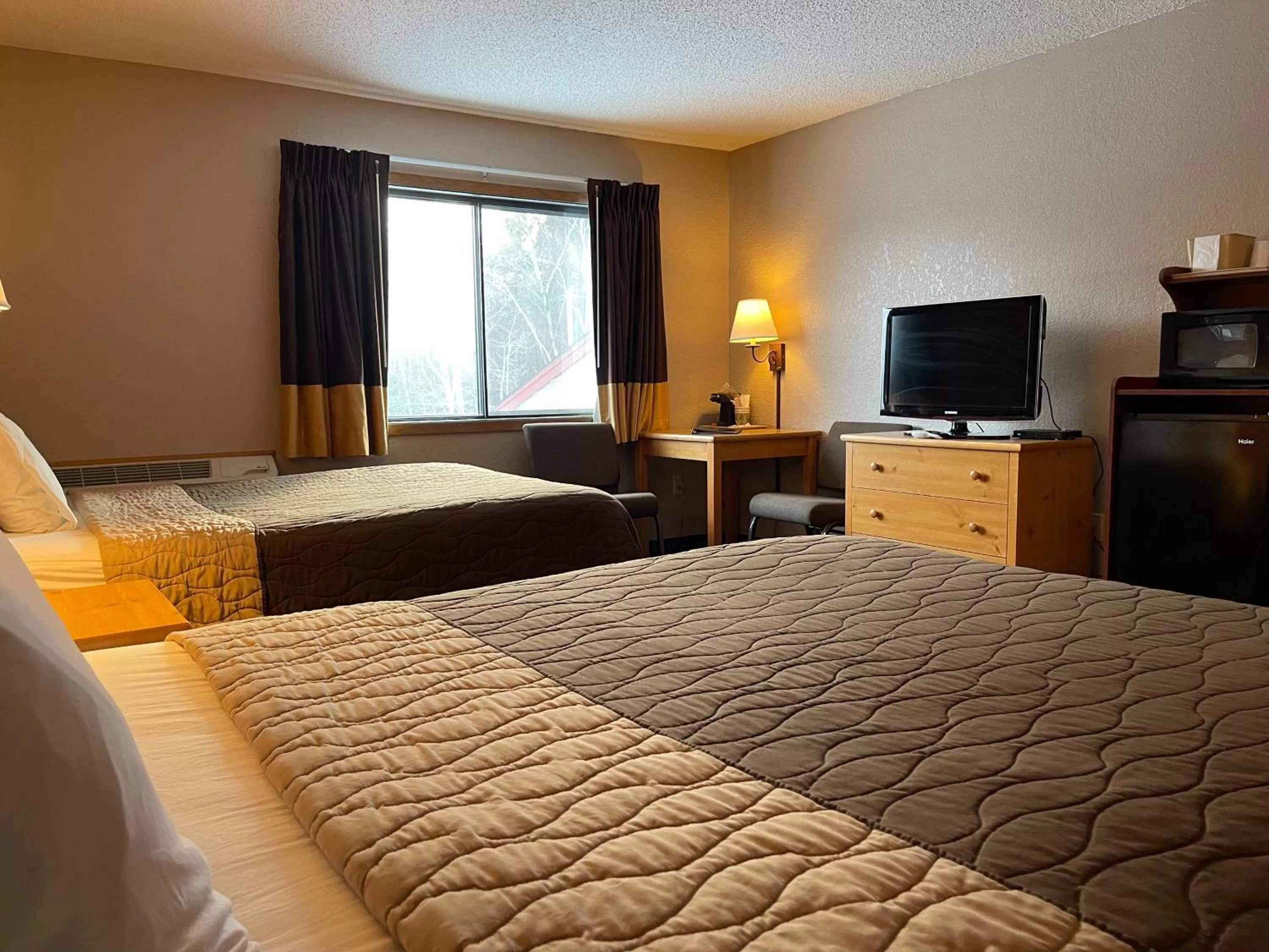 Queen Room with Two Queen Beds - single occupancy - Non-Smoking in Walker Hotel