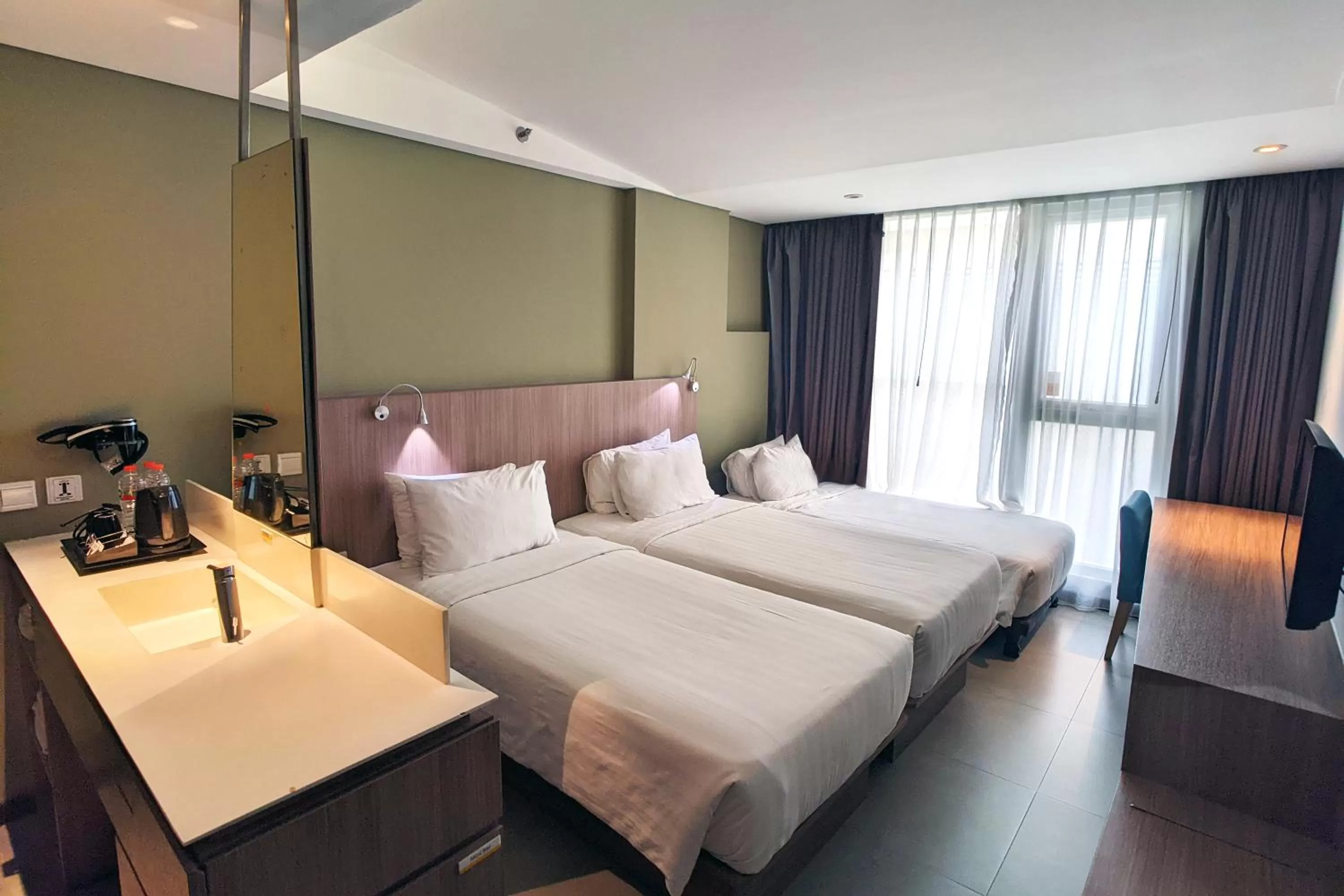 Deluxe Triple Room in Episode Kuta Bali