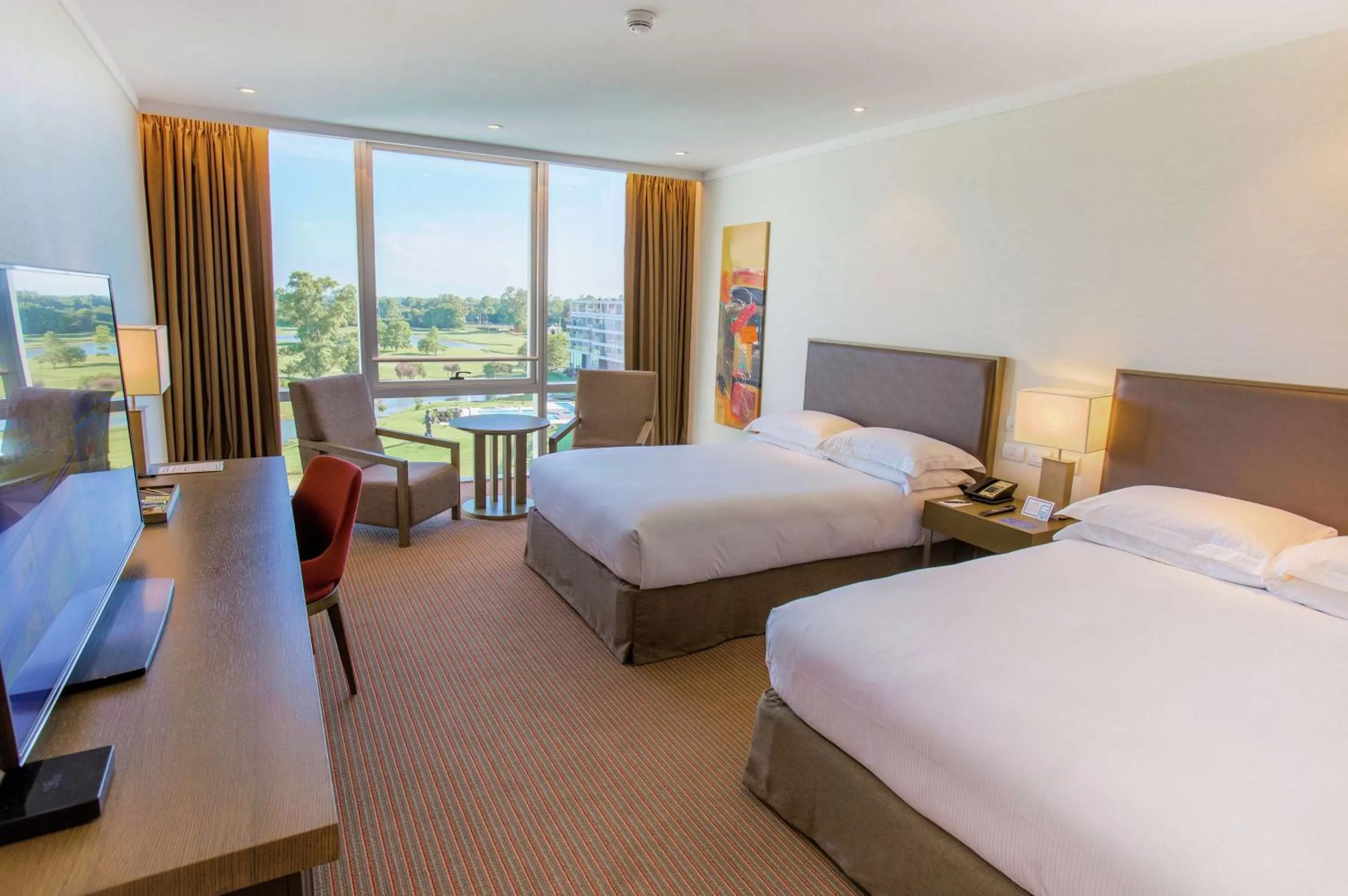 Deluxe Queen Room with Two Queen Beds - single occupancy in Hilton Pilar
