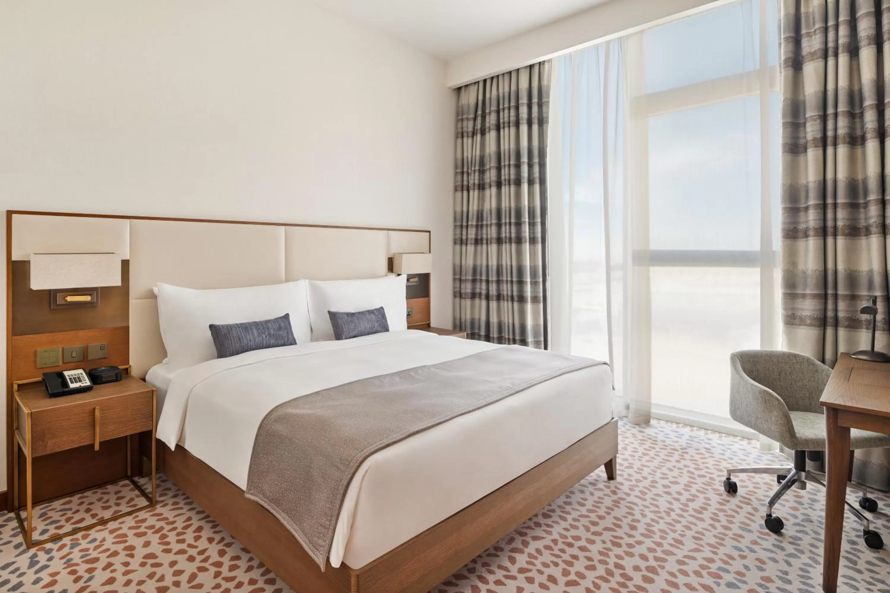 One-Bedroom King Suite with Pool View in Staybridge Suites Dubai Al-Maktoum Airport by IHG