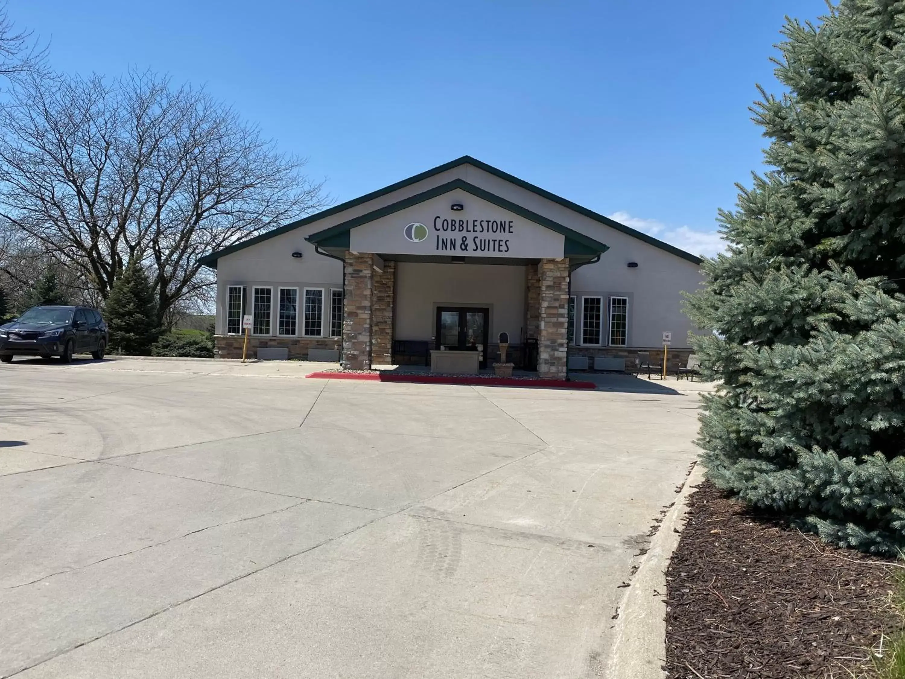 Property building in Cobblestone Inn & Suites - Denison | Majestic Hills Property building in Cobblestone Inn & Suites - Denison | Majestic Hills