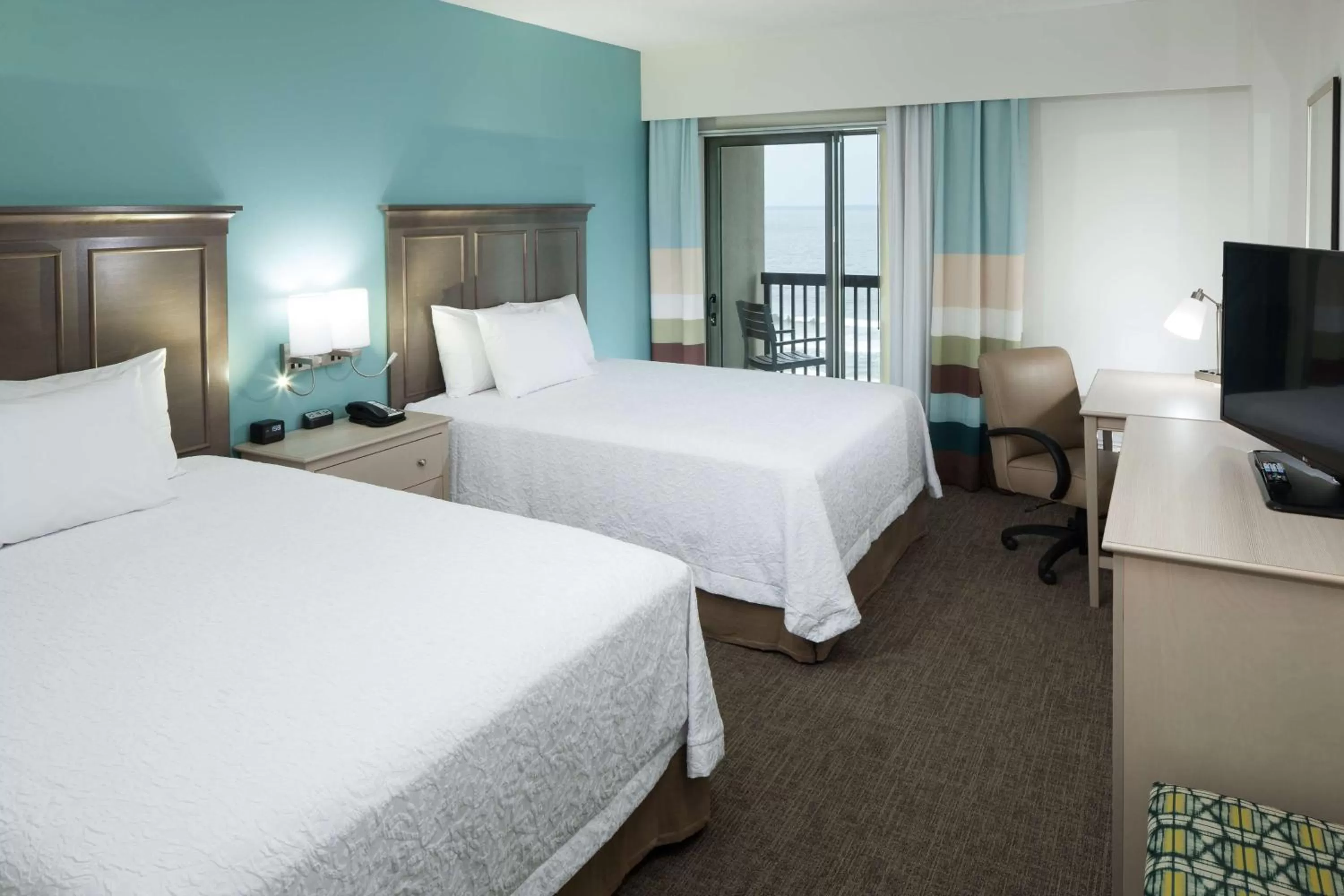 Queen Room with Balcony - Ocean Front/Hearing Accessible in Hampton Inn & Suites by Hilton Carolina Beach Oceanfront