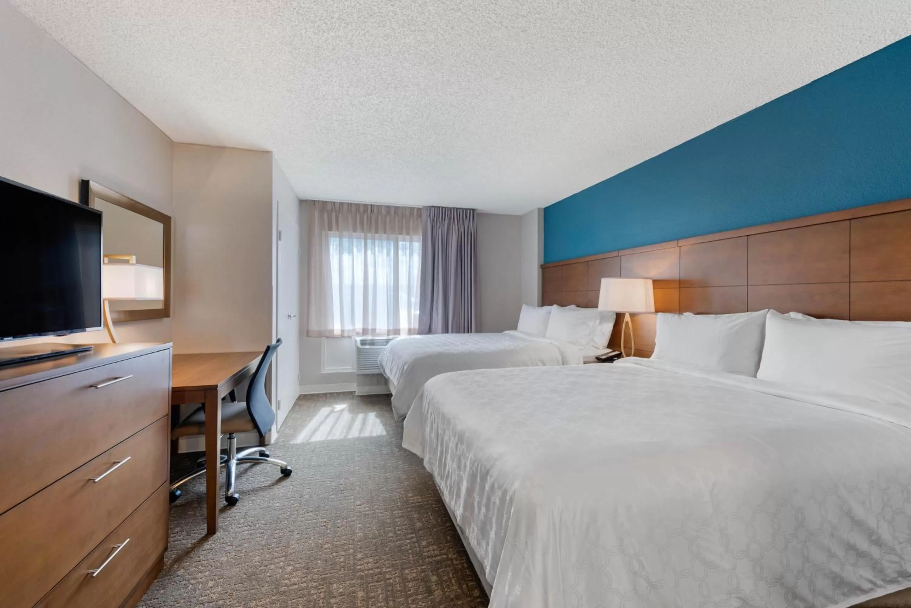 Two-Bedroom Suite with One King and Two Queen Beds in Staybridge Suites Orlando Royale Parc Suites by IHG