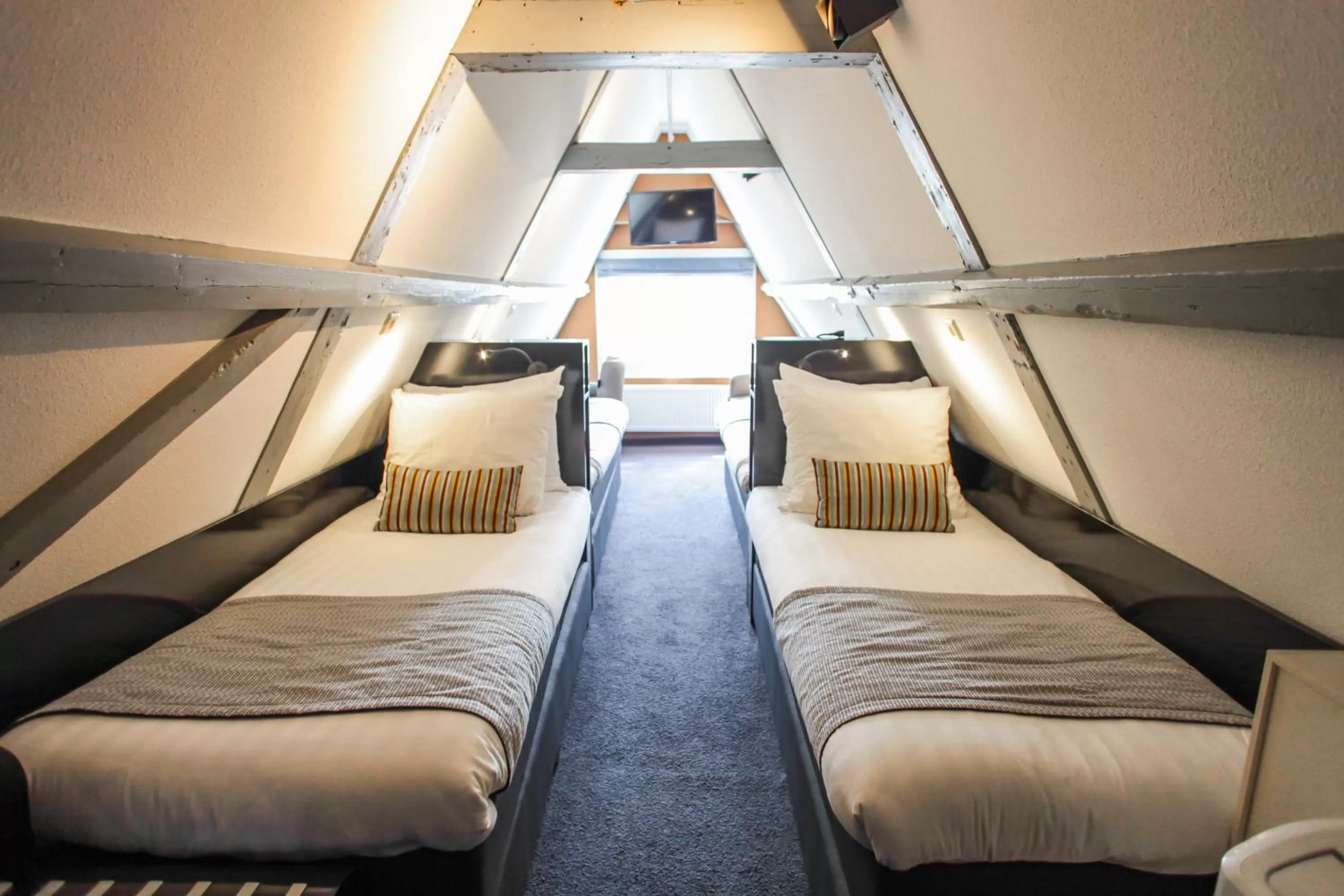 Attic Quad Room with Limited Elevator Access in Hotel Mansion