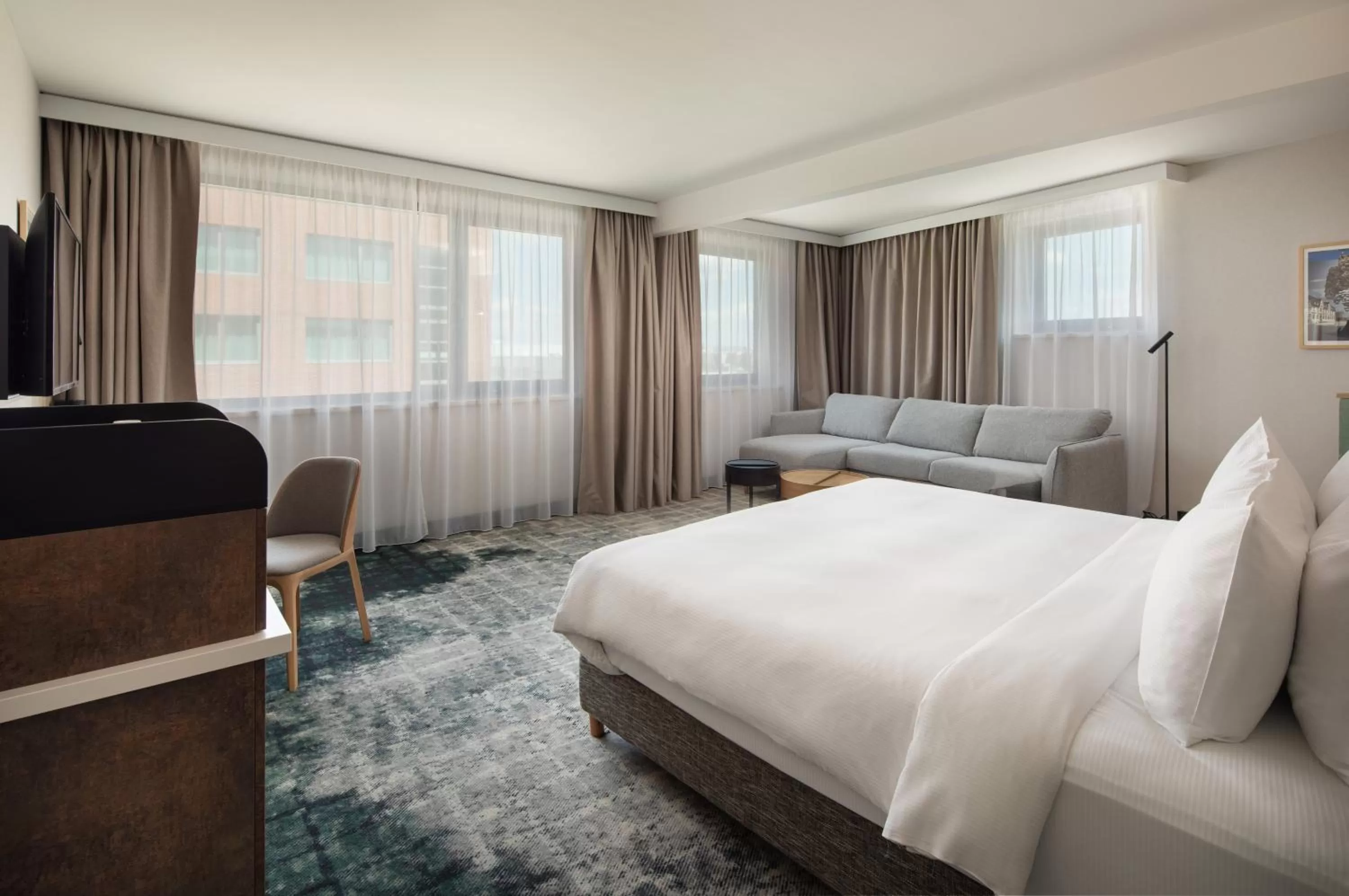 King Bed Deluxe with sofa bed in Crowne Plaza Budapest by IHG