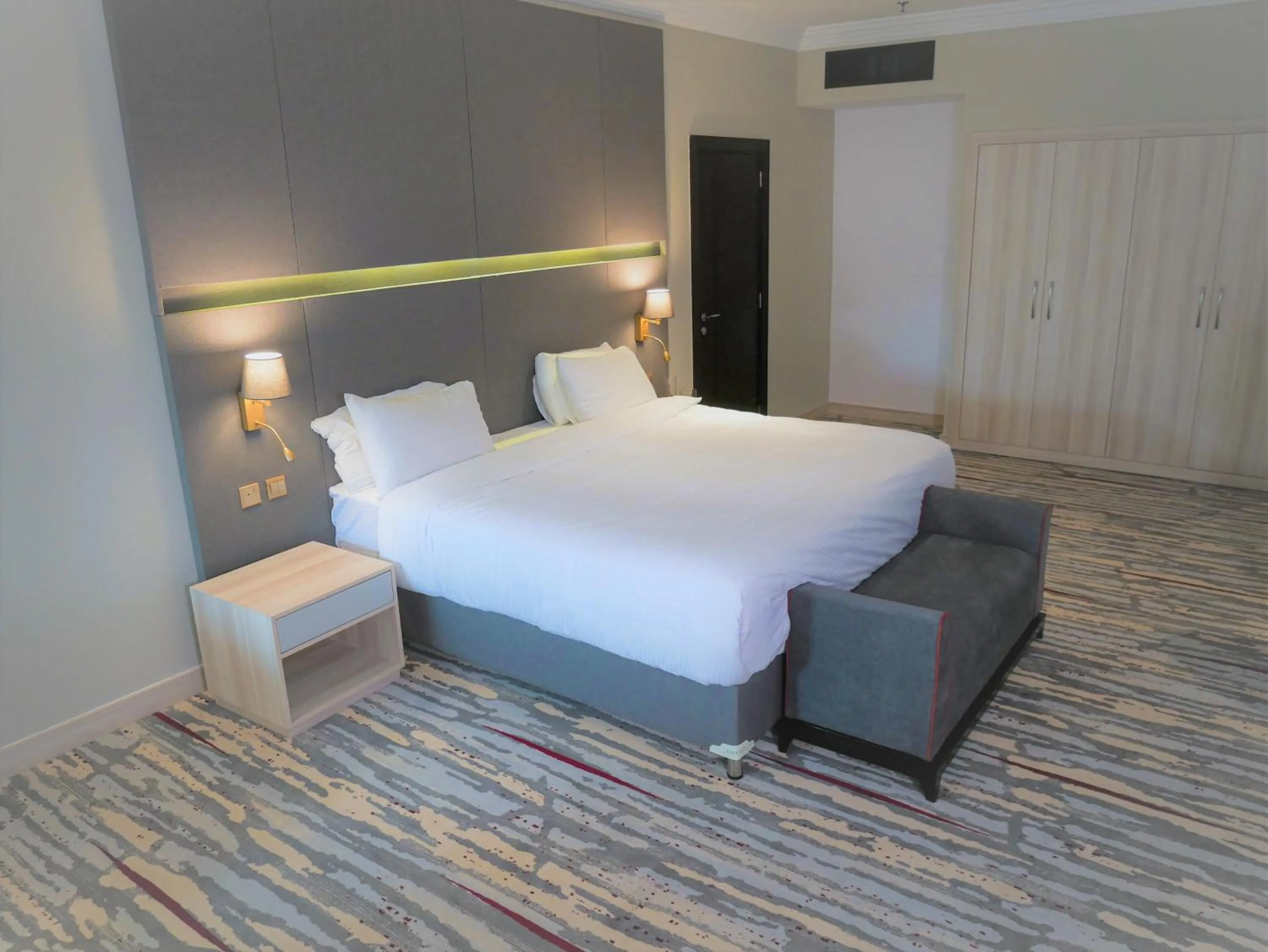 Chic King Room with Mobility Access, Roll-In Shower with Grab Bars - Smoking in Ramada by Wyndham Doha Old Town