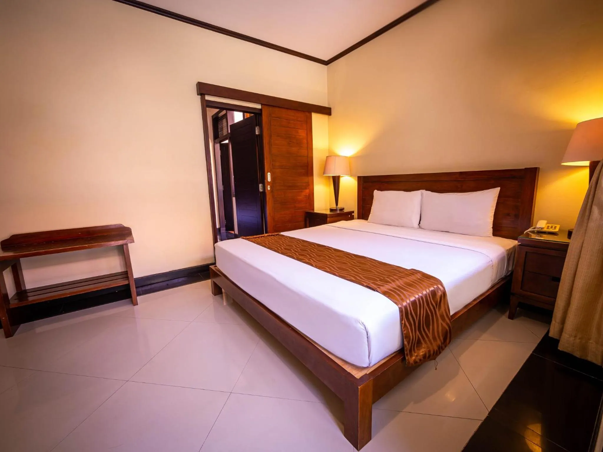 Deluxe Interconnecting Room with Garden View in Yulia Beach Inn Kuta