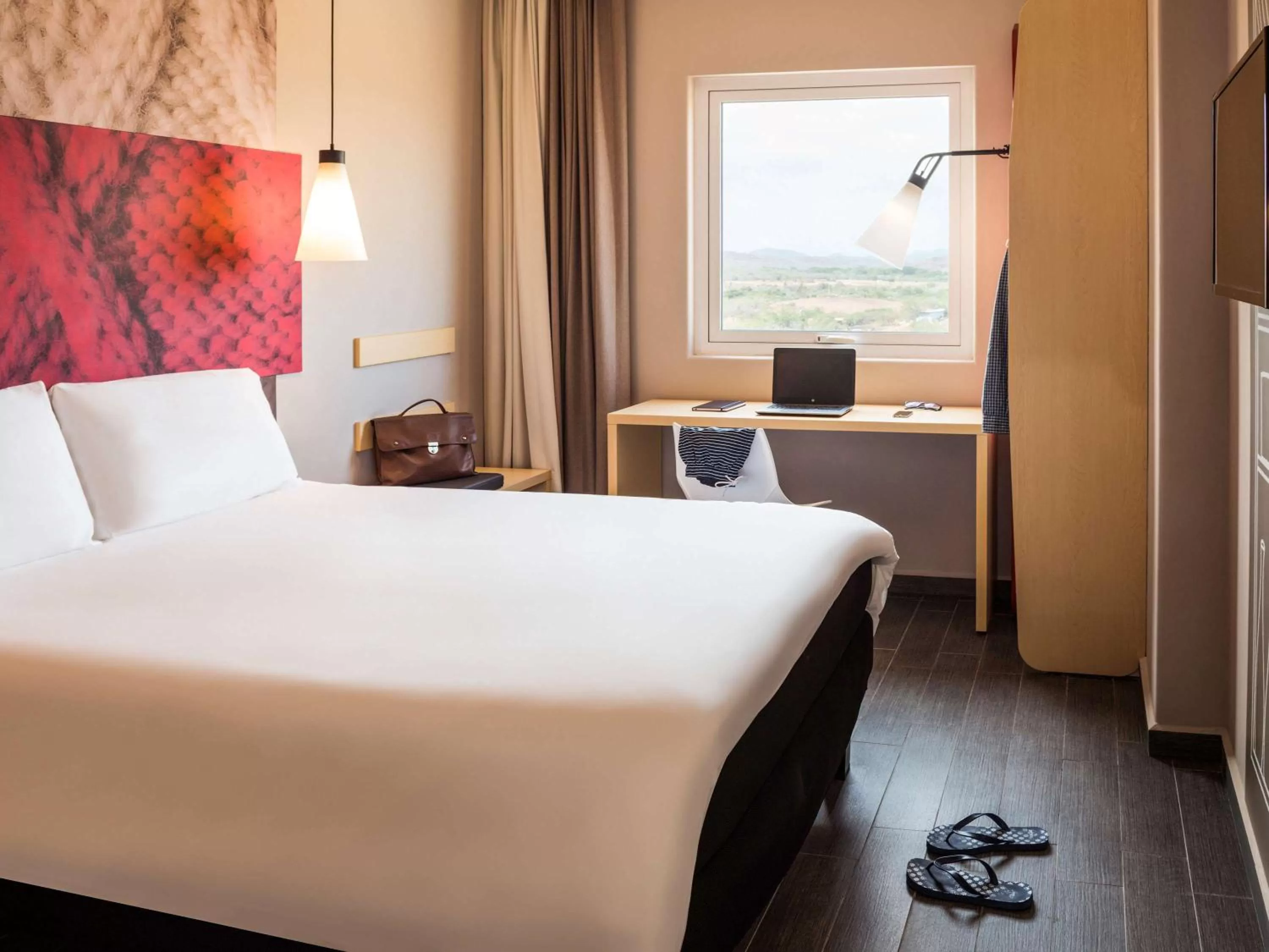 Room with one Queen size bed in Ibis Mazatlan Marina