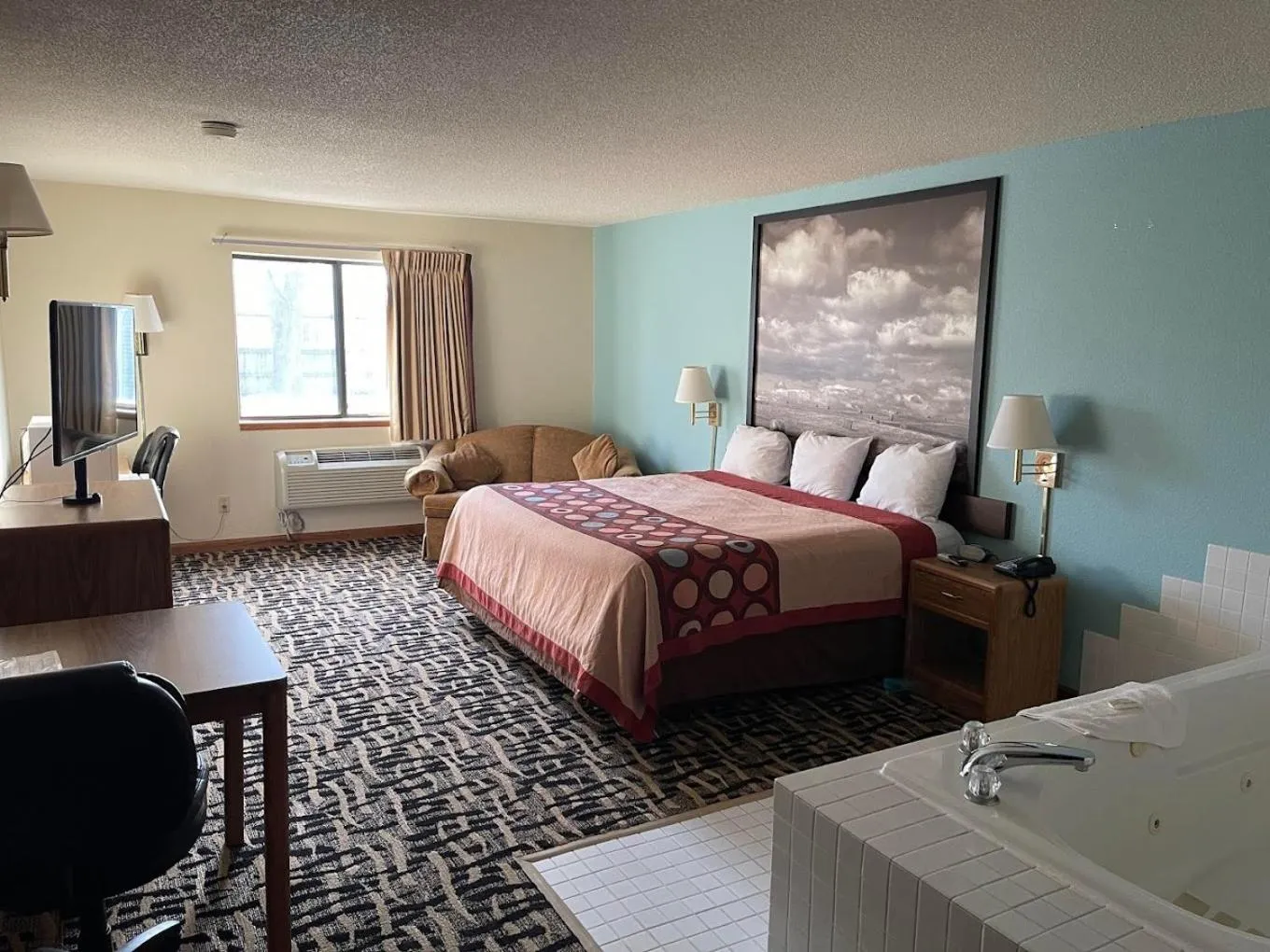 King Bed with Jetted Tub in OYO West Point Inn