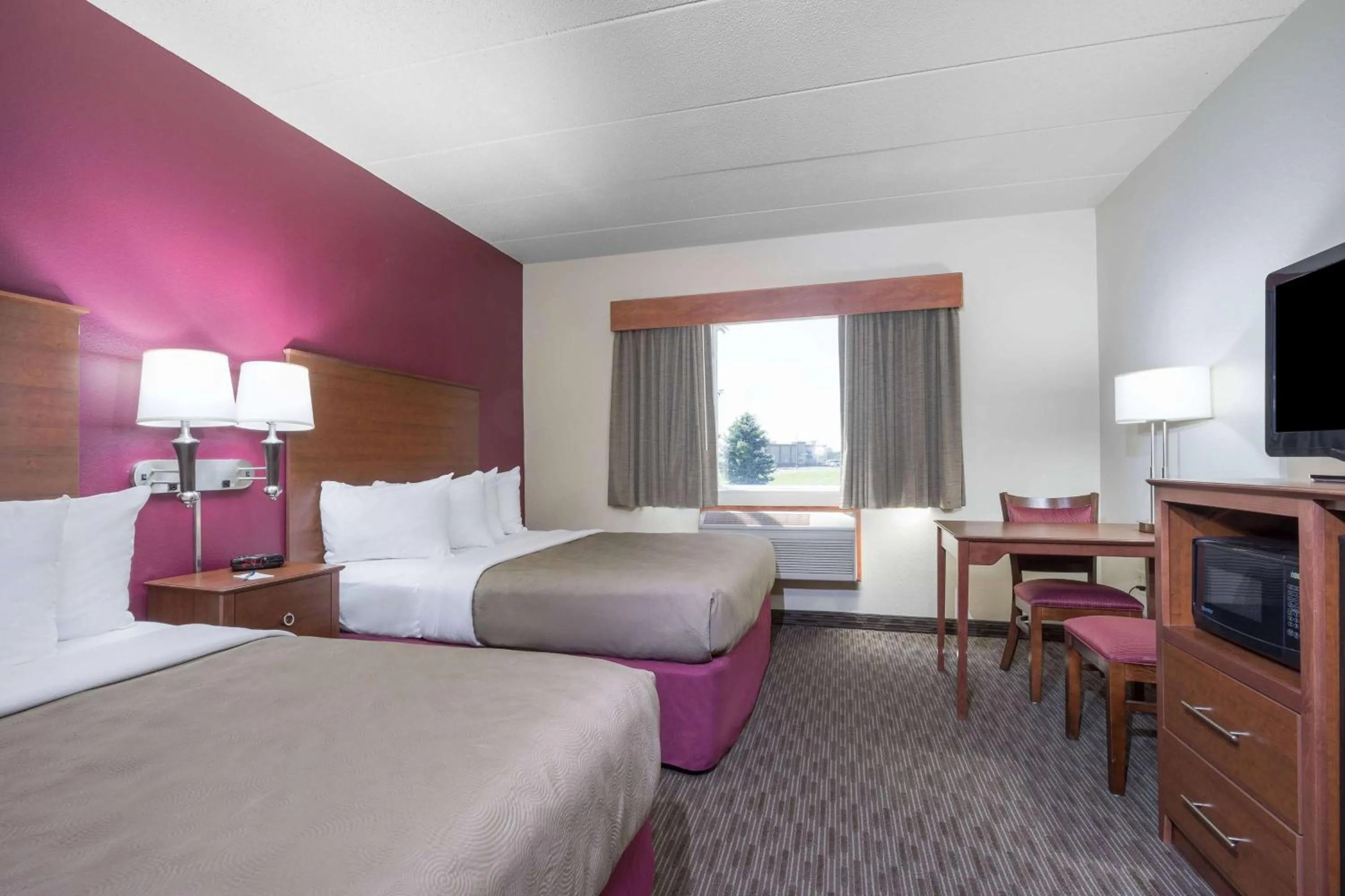 Queen Room with Two Queen Beds, Mobility Access and Roll-In shower, Non-Smoking in AmericInn by Wyndham Baldwin