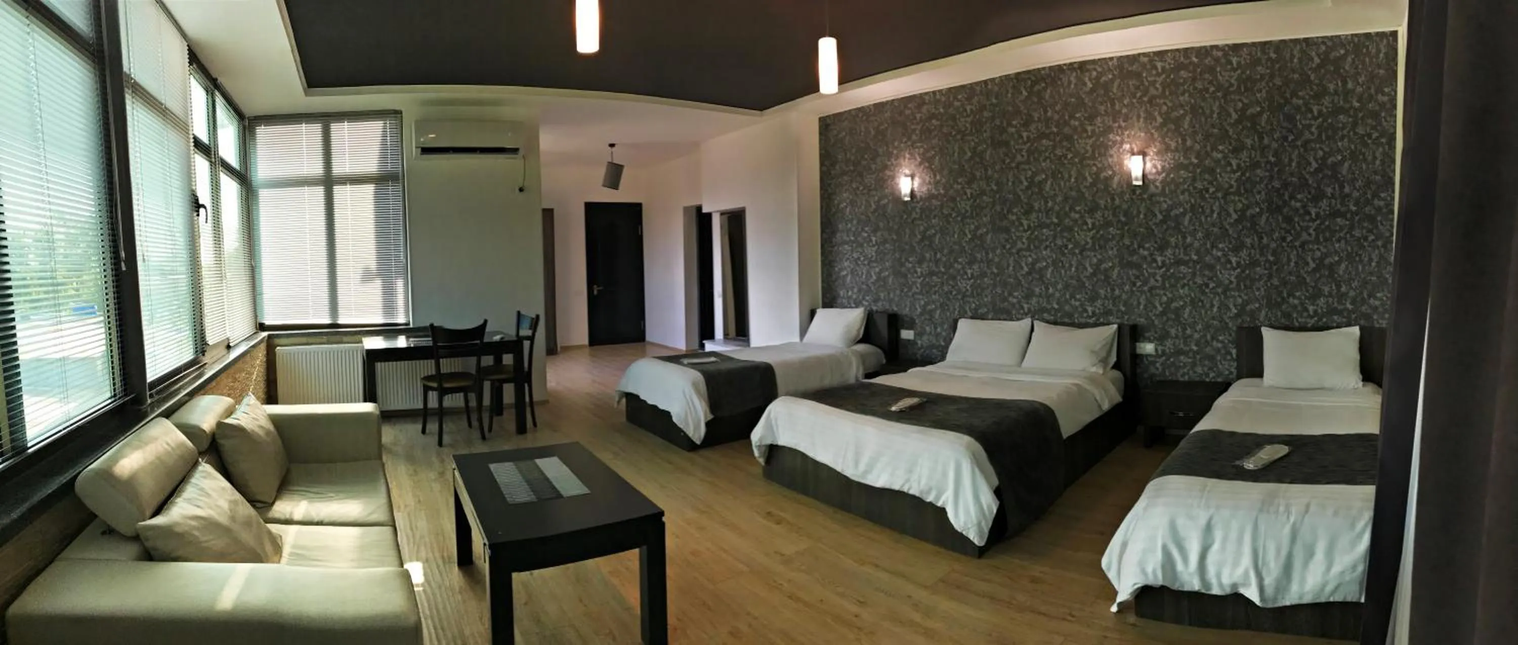 Family Room with Balcony in Continental Hotel