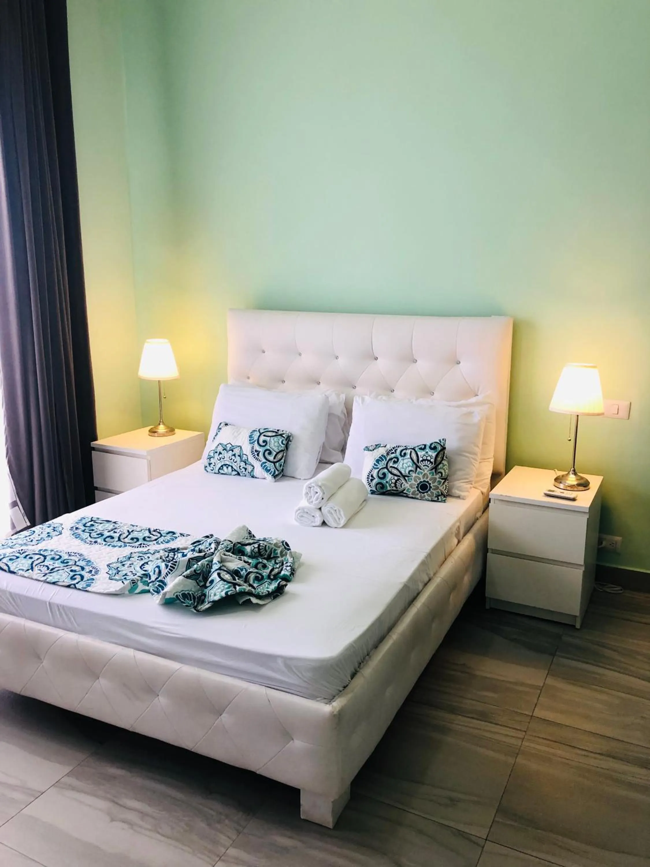 Bed in Ducassi Rooftop Pool Suites Beach Club and SPA