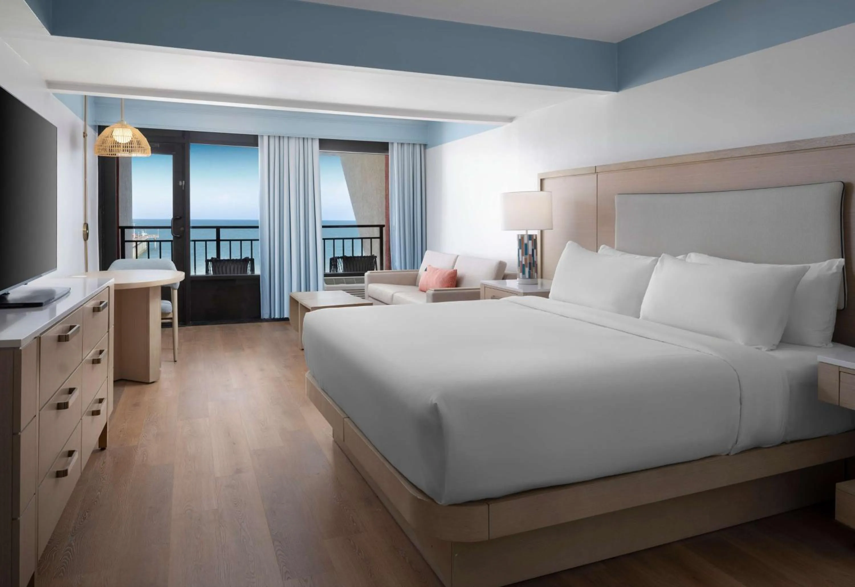 King Room with Sofa Bed and Partial Ocean View in The Ellie Beach Resort Myrtle Beach, Tapestry By Hilton