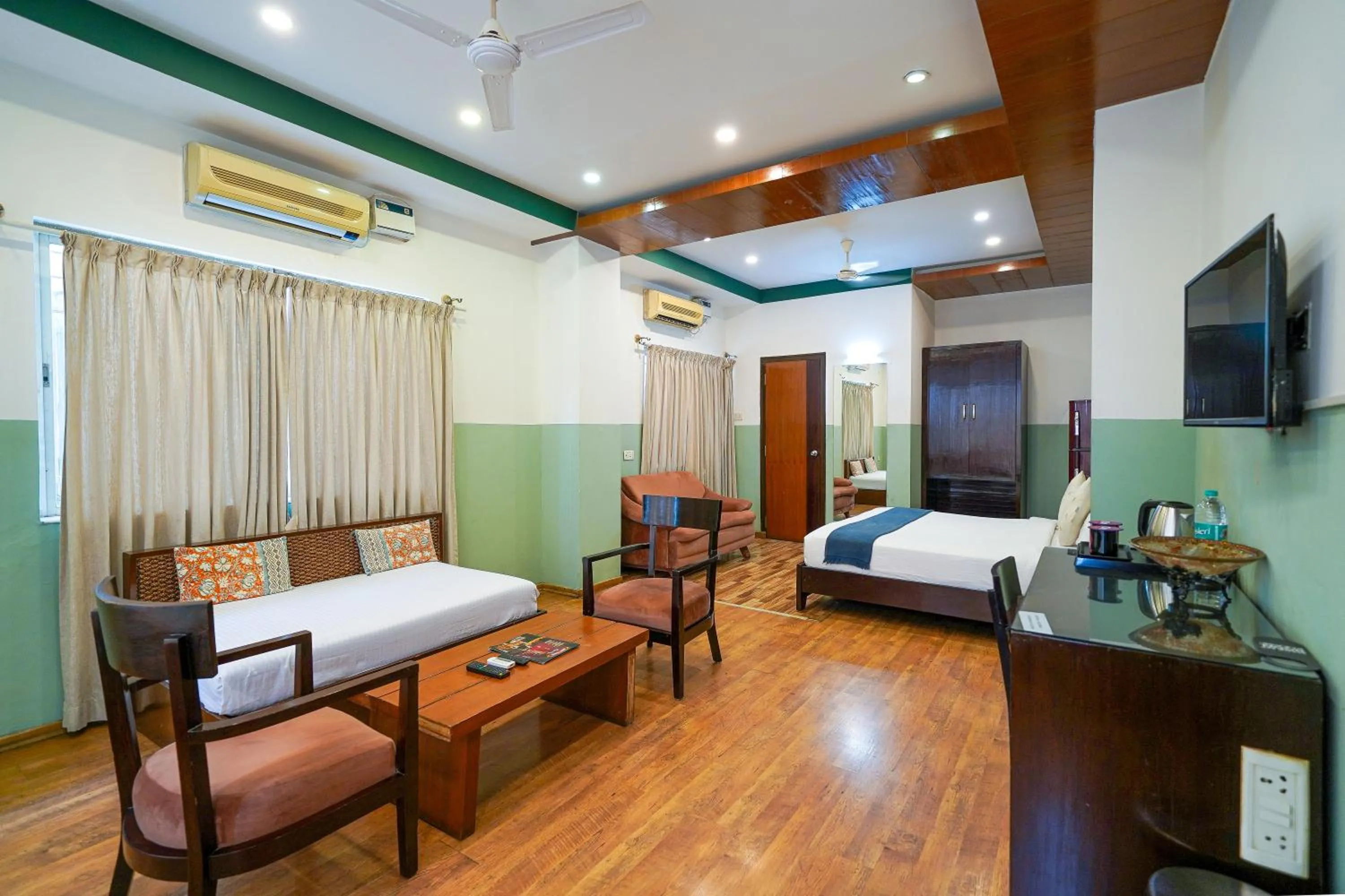 Suite in Olive Zip Rest House Road by Embassy Group