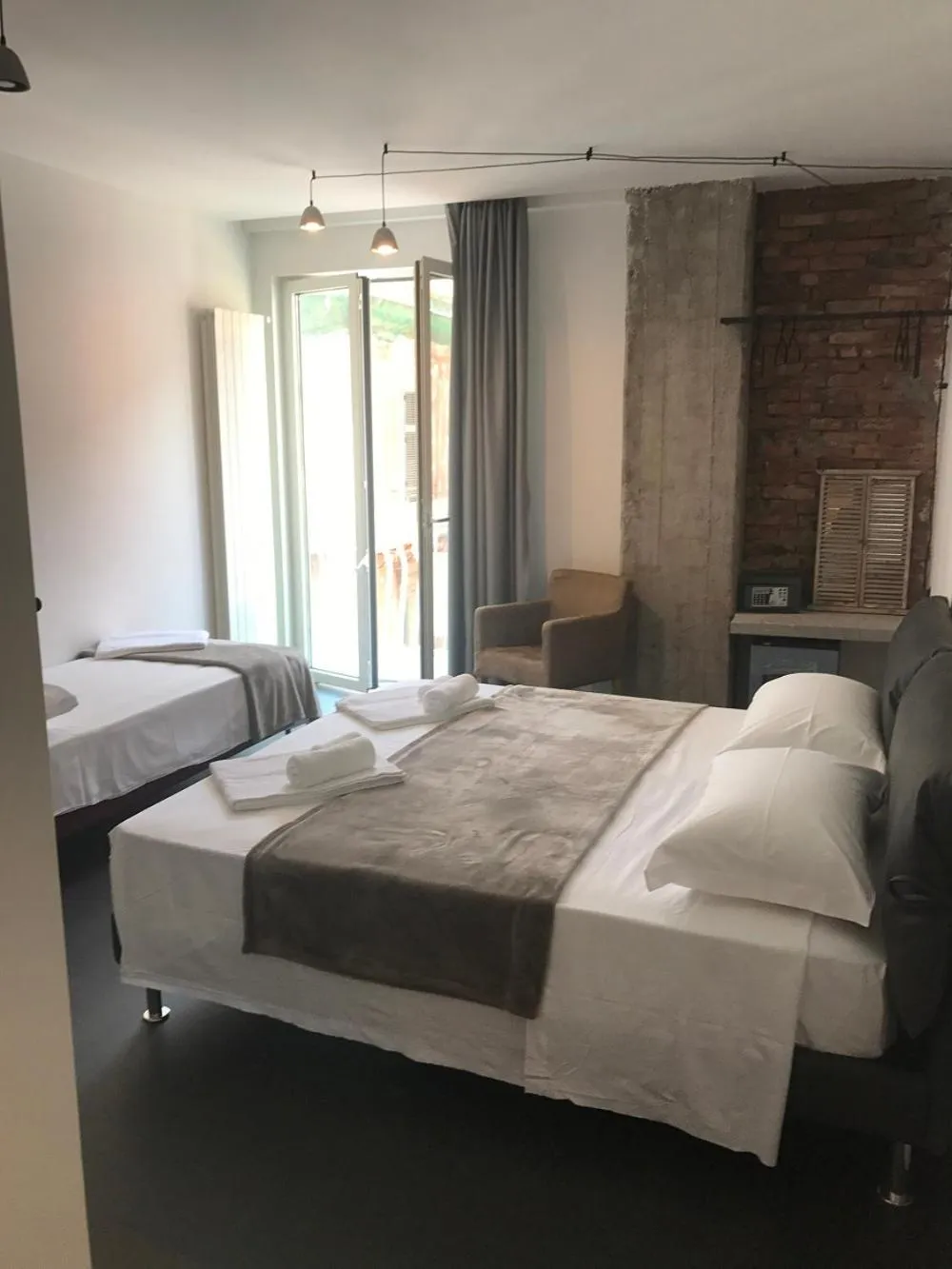 Deluxe Triple Room with Balcony - single occupancy in The Boutique Napoli Suite