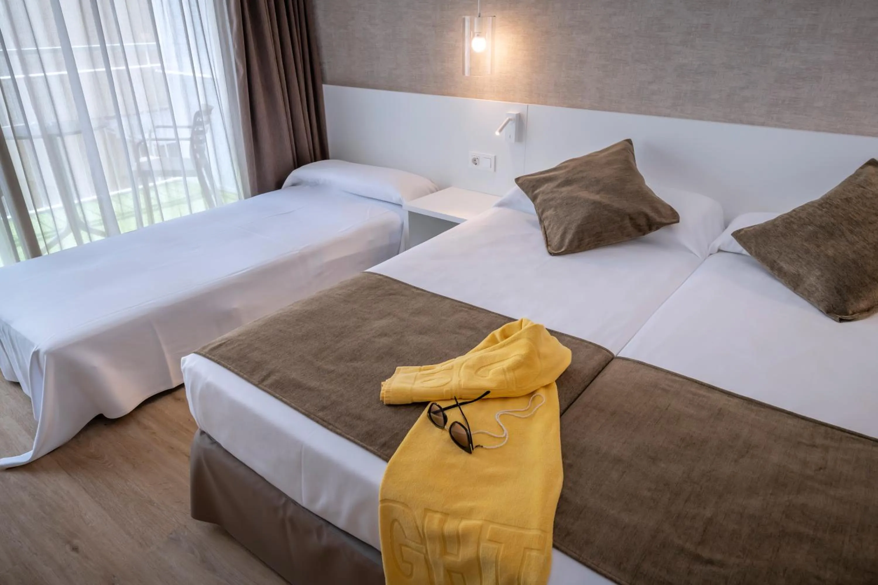 Twin Room with Extra Bed and Balcony (2 Adults + 1 Child) in GHT Costa Brava & Spa