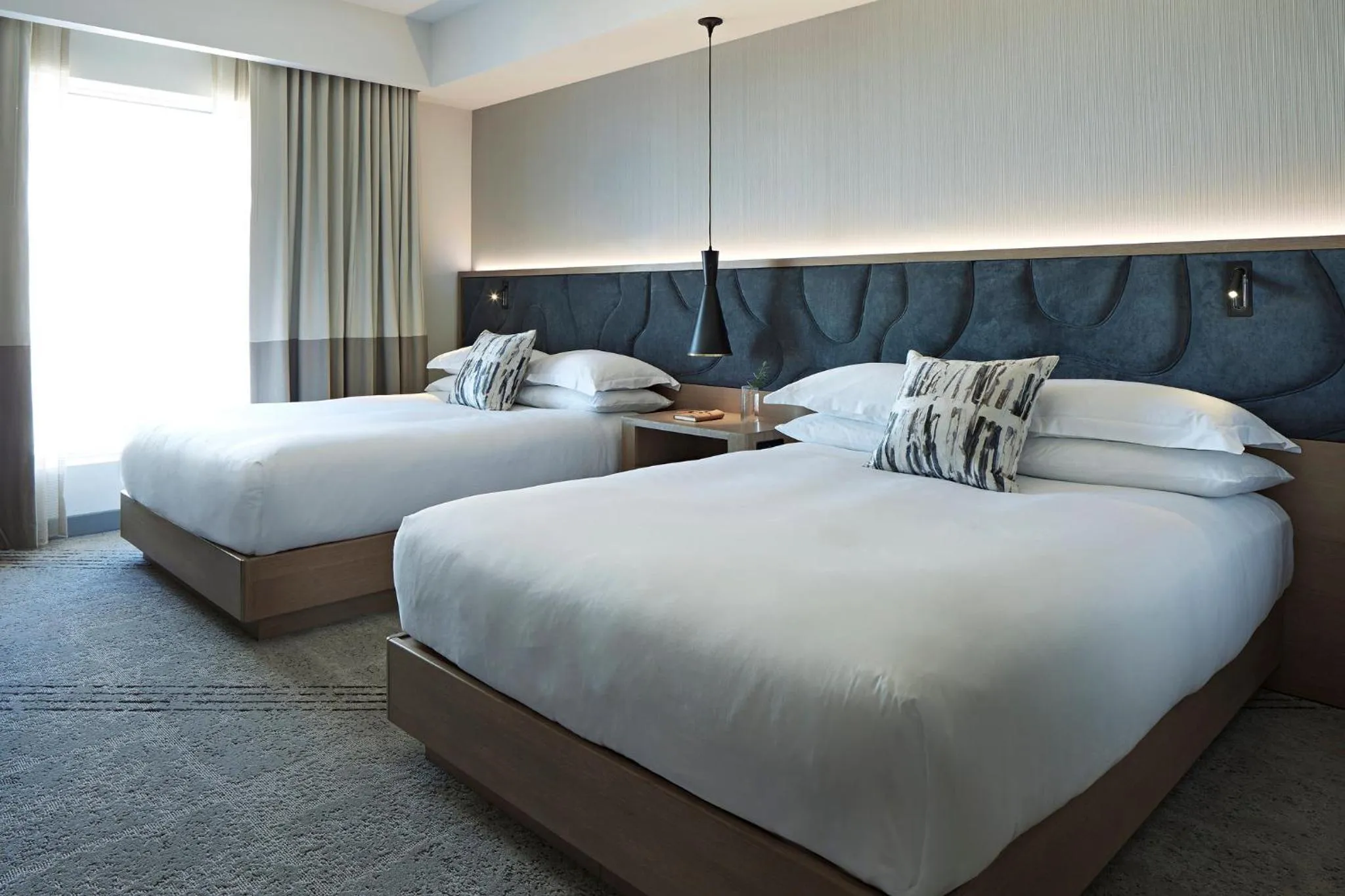 Essential Queen Room with Two Queen Beds and View in Kimpton Sawyer Hotel by IHG