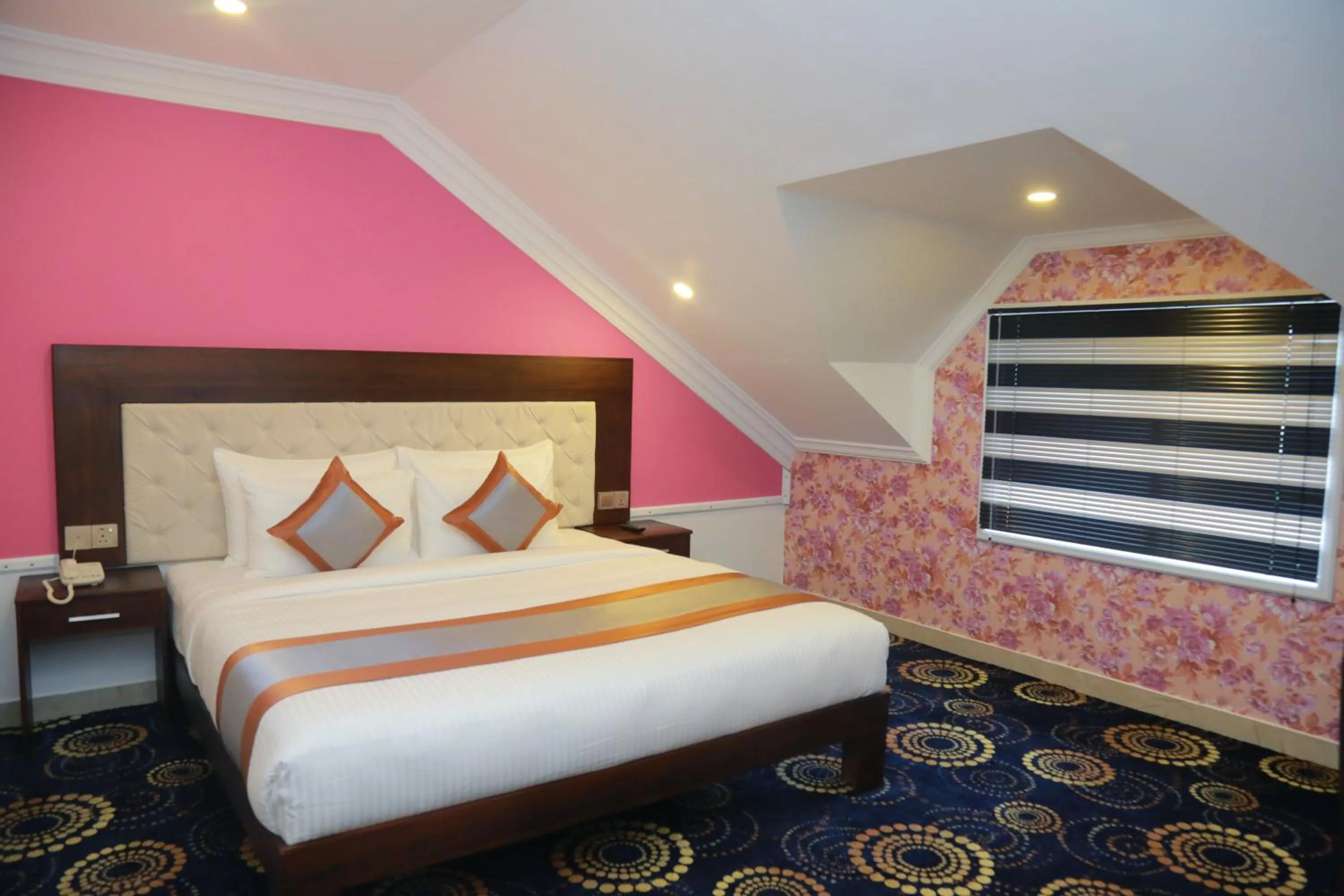 Deluxe Double Room with Window and Attic Style in Galaxy Grand Hotel