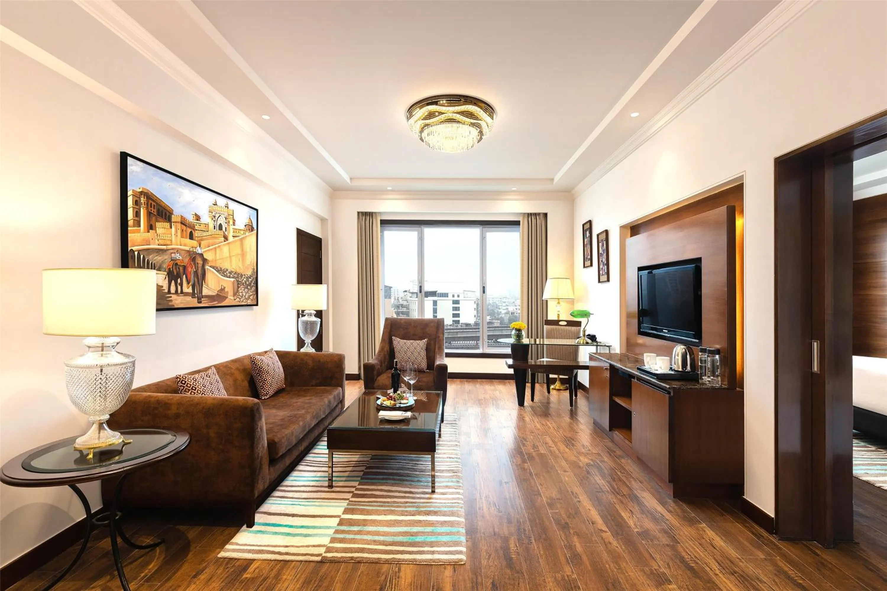 Suite (2 Way Airport Transfer,20% off on SPA, INR 2000 F&B credit, Daily Fruit basket, 1 bottle of whiskey/wine as per availability, Dinner in Dragon If all meals room is booked, Sightseeing transport services, Laundry Service and Lounge Access) in Radisson Jaipur City Center