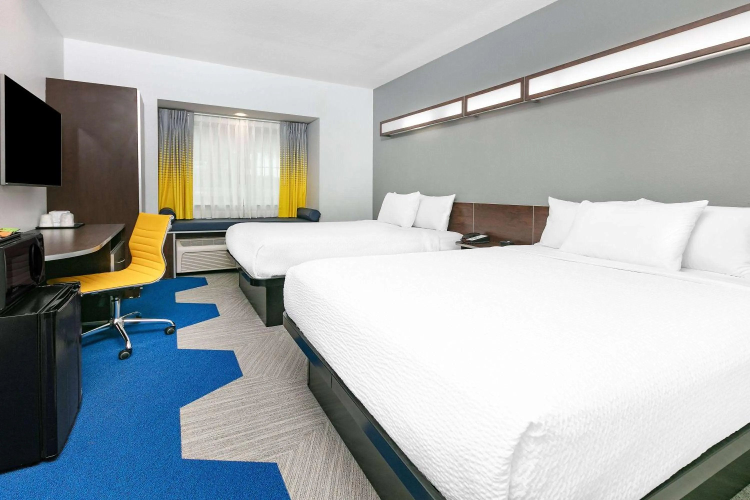 Queen Room with Two Queen Beds - Non-Smoking in Microtel Inn & Suites by Wyndham Austin Airport