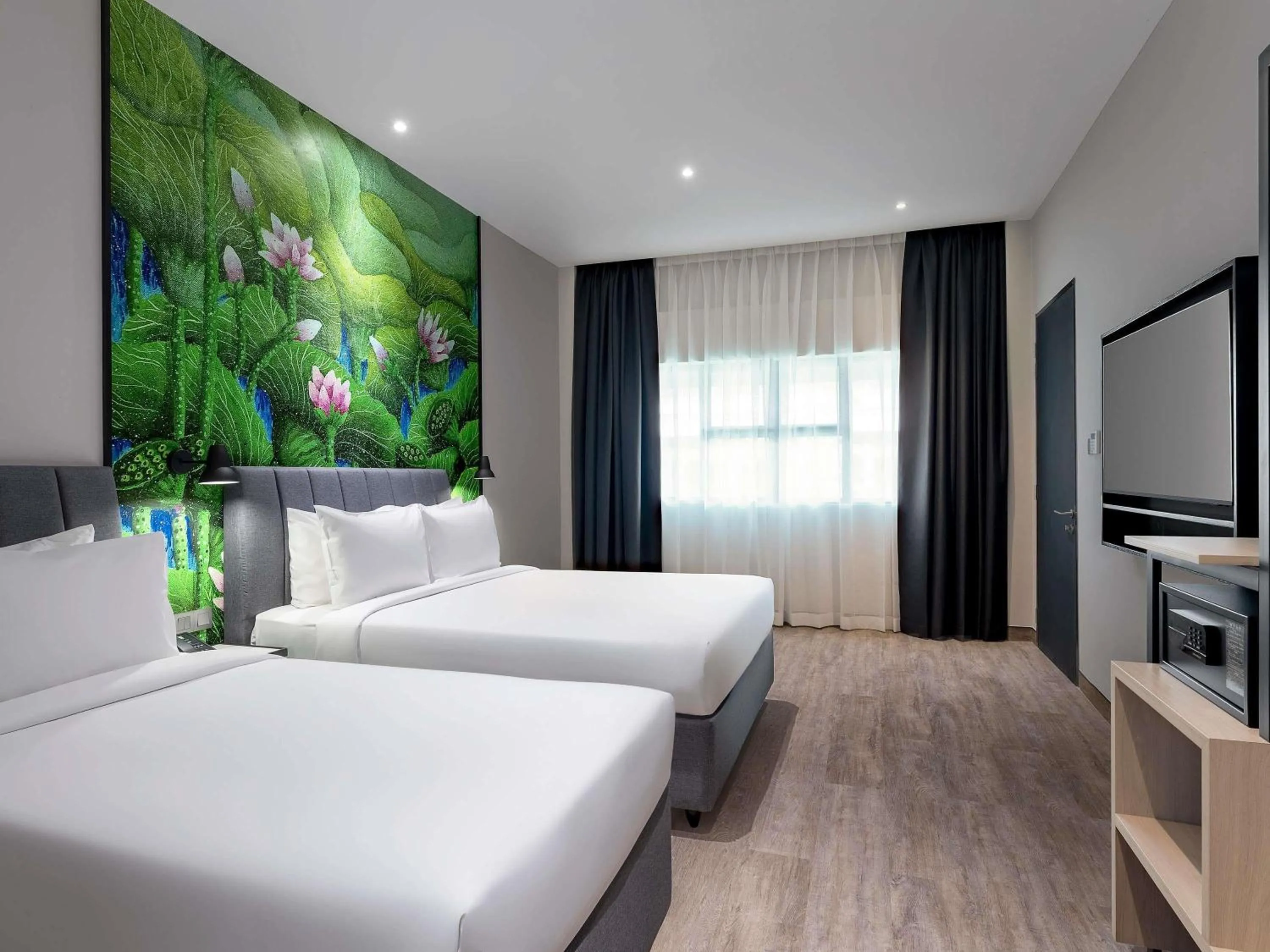 Family Room with One Queen and One Single Bed in ibis Styles Sepang KLIA