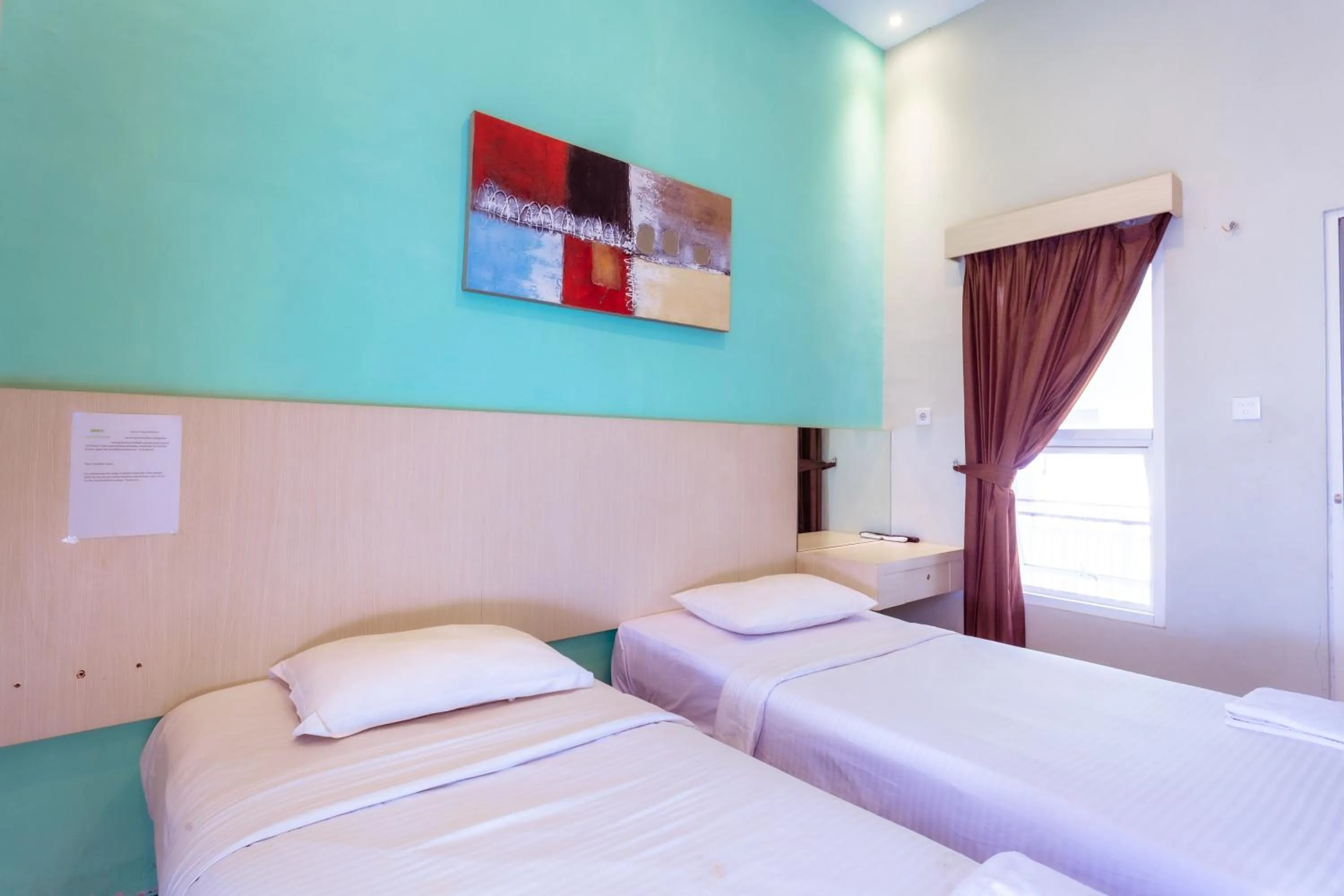 Deluxe Twin Room in Ardhya Guesthouse Syariah by ecommerceloka