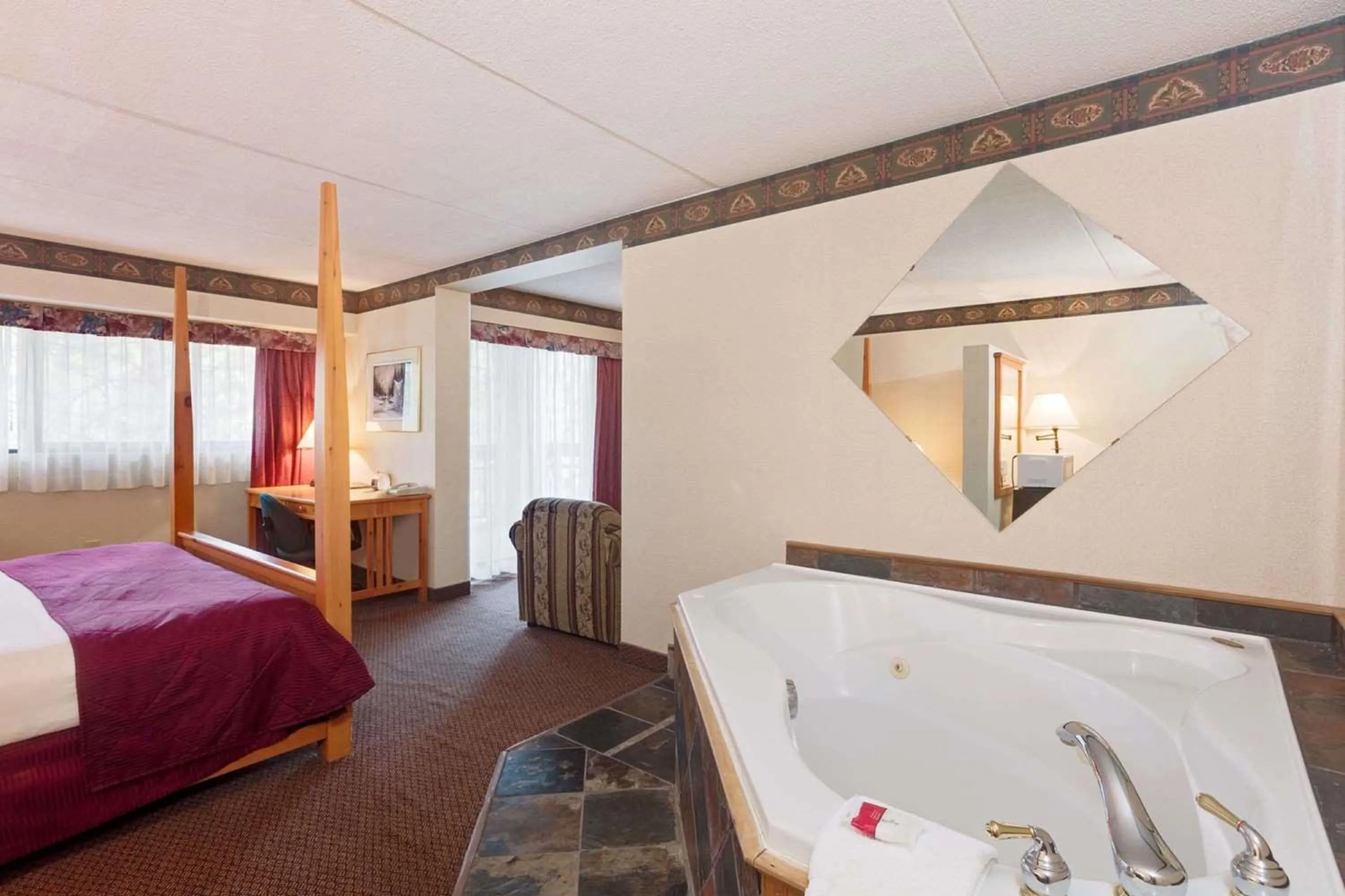 Superior King Suite with Hot Tub - Non-Smoking in Ramada by Wyndham Pinewood Park Resort North Bay