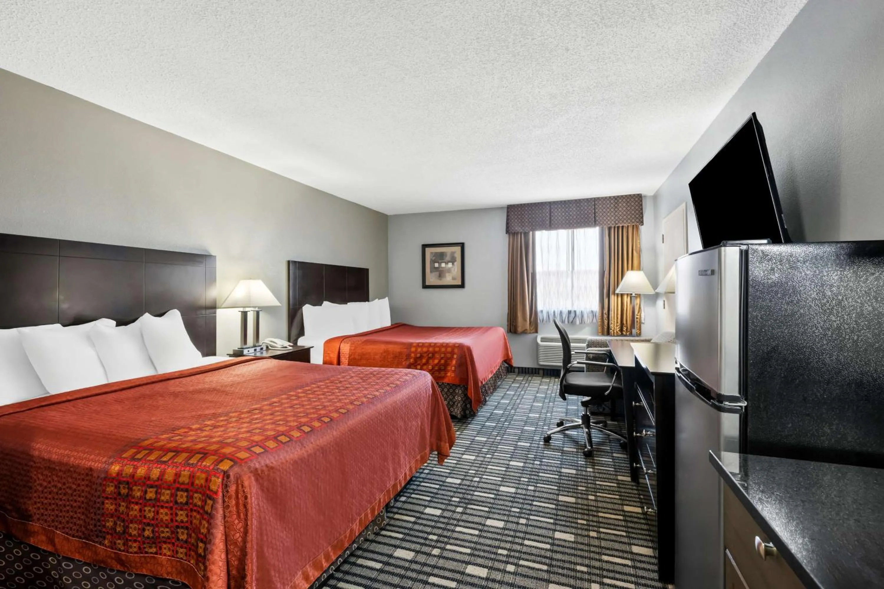 Queen Room with Two Queen Beds and Kitchenette in SureStay Plus Hotel by Best Western Lubbock Medical Center