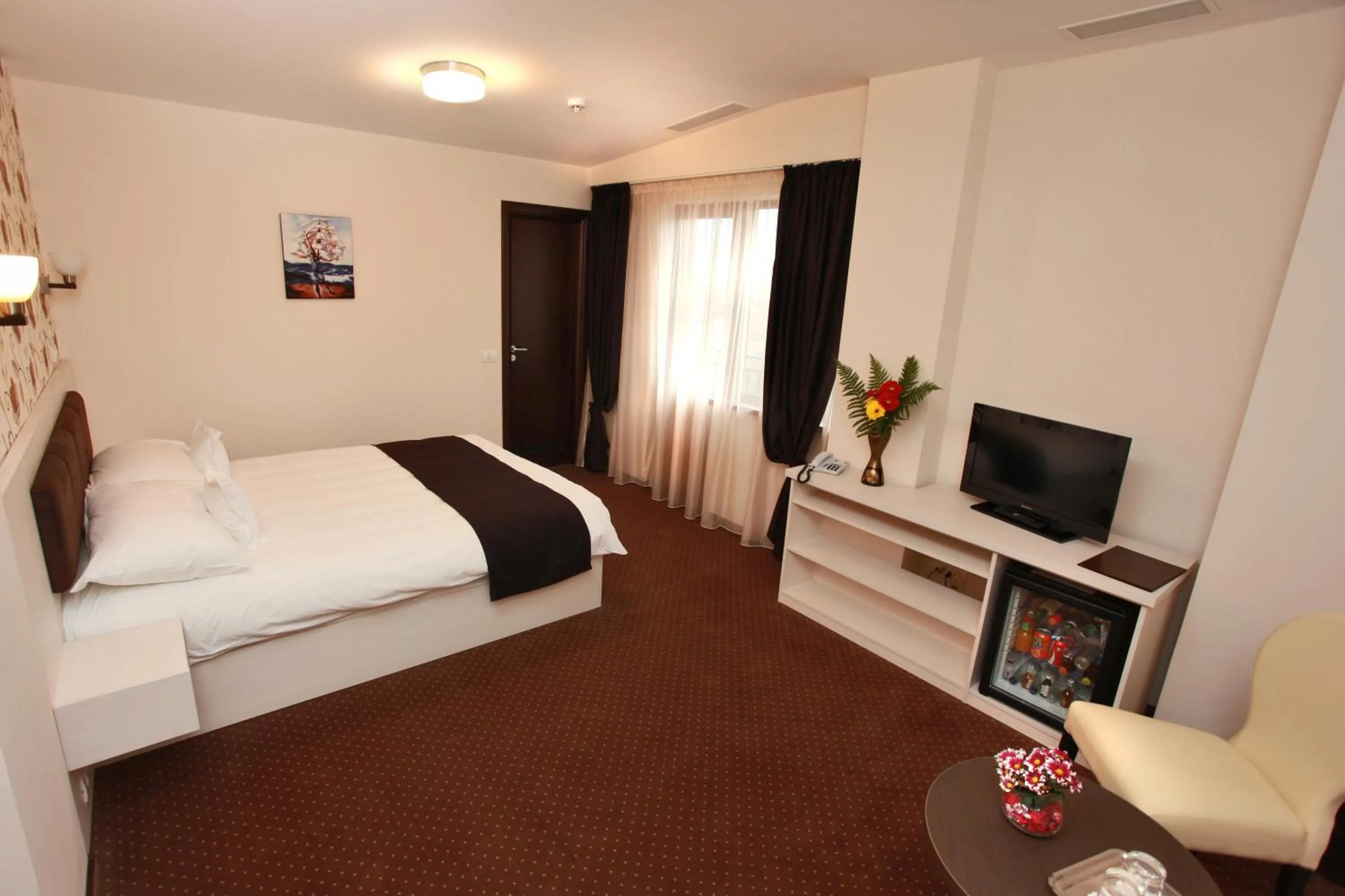 Bed in West Plaza Hotel