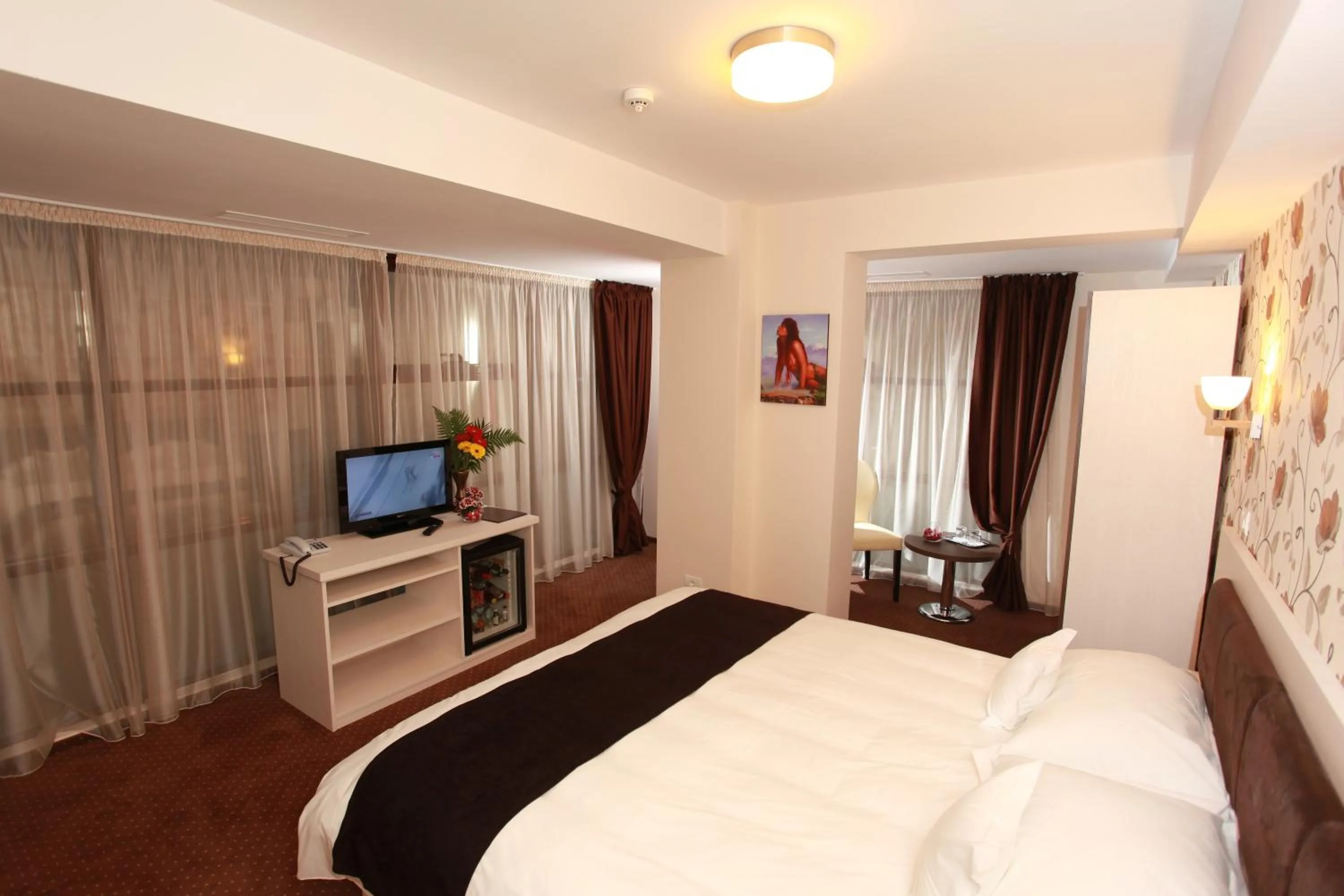 Bed in West Plaza Hotel