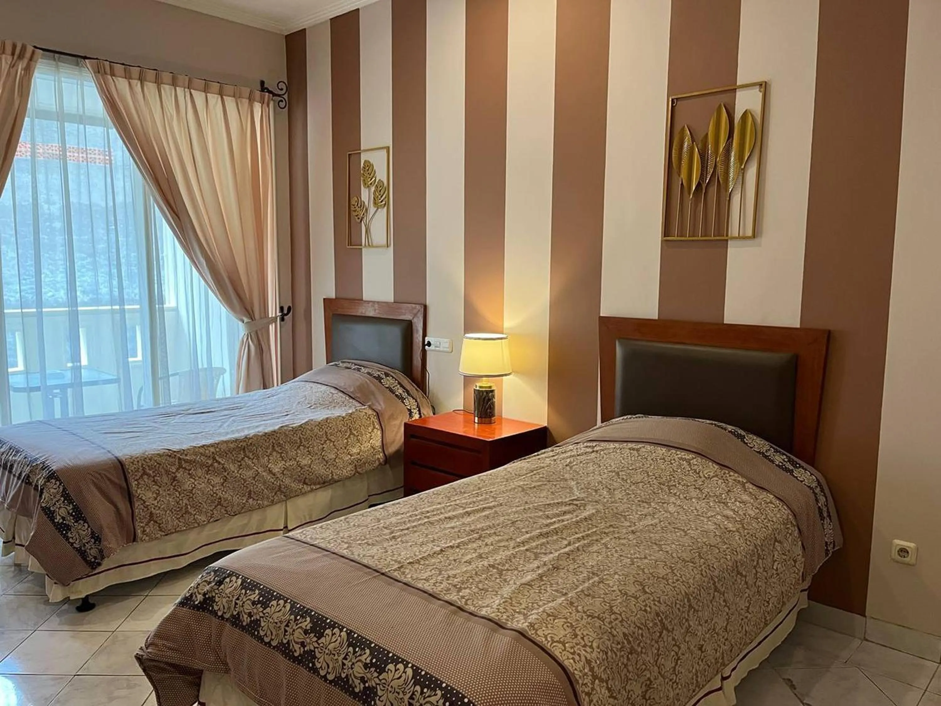 Deluxe Twin Room in Puri Sawo Manila