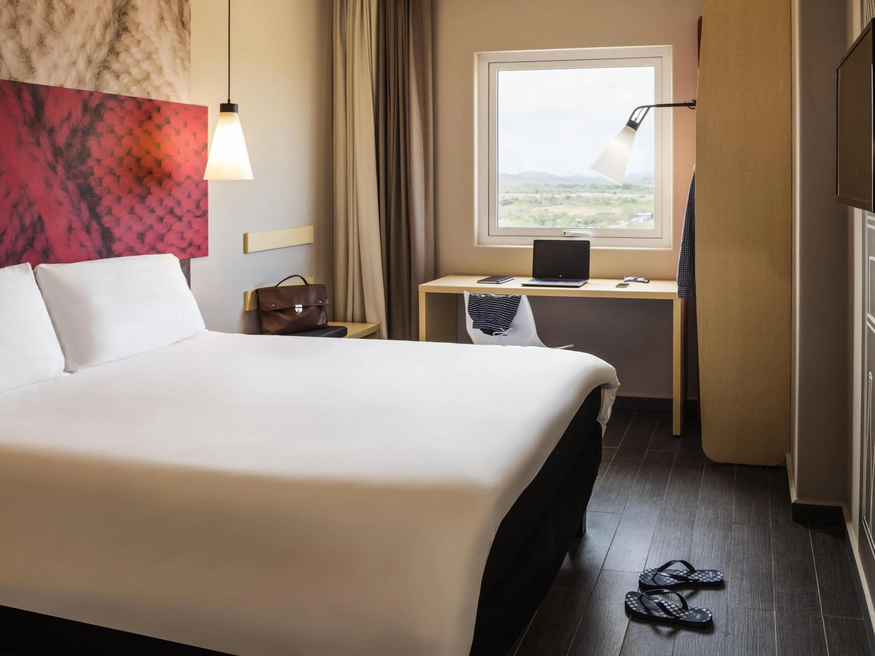 Room with one Queen size bed in Ibis Mazatlan Marina