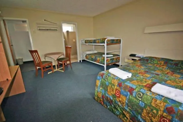 Family Room with One Queen Bed and Bunk Beds in Red Cedars Motel