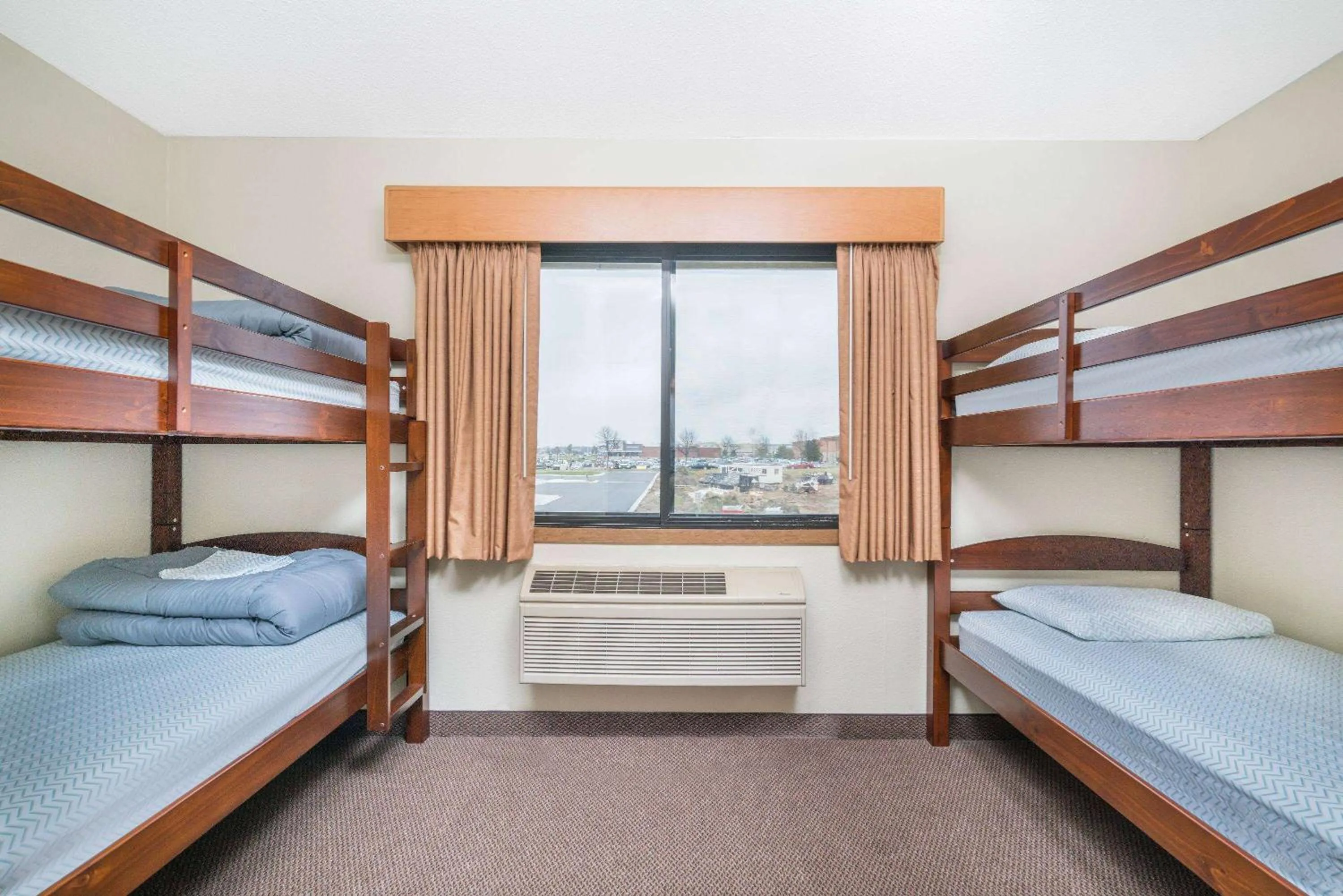 Two-Bedroom Suite with One King and Two Bunk Beds - Non-Smoking in Days Inn & Suites by Wyndham Baxter Brainerd Area