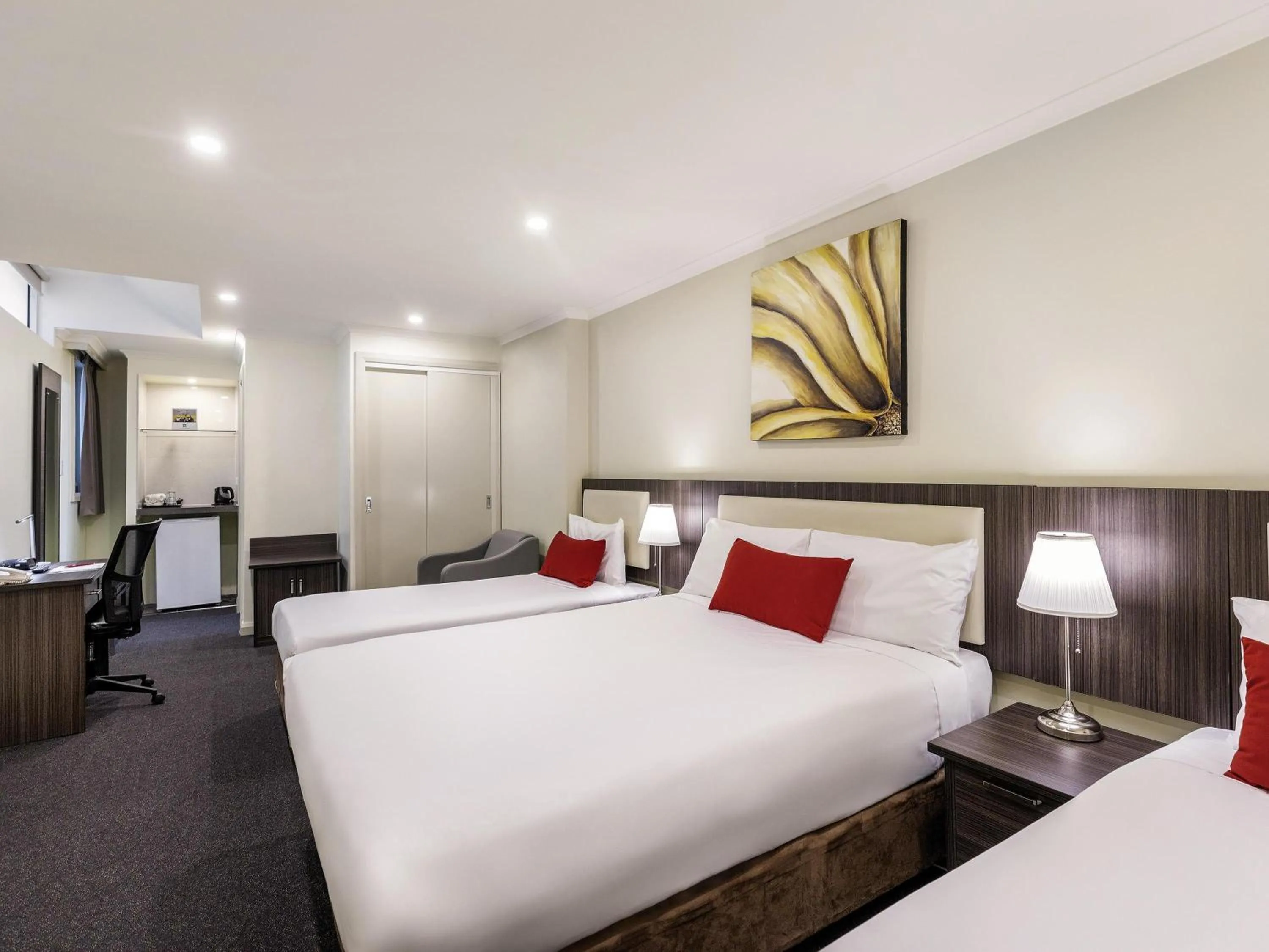 Family Room with One Double and Two Single Beds in ibis Styles Kingsgate Hotel