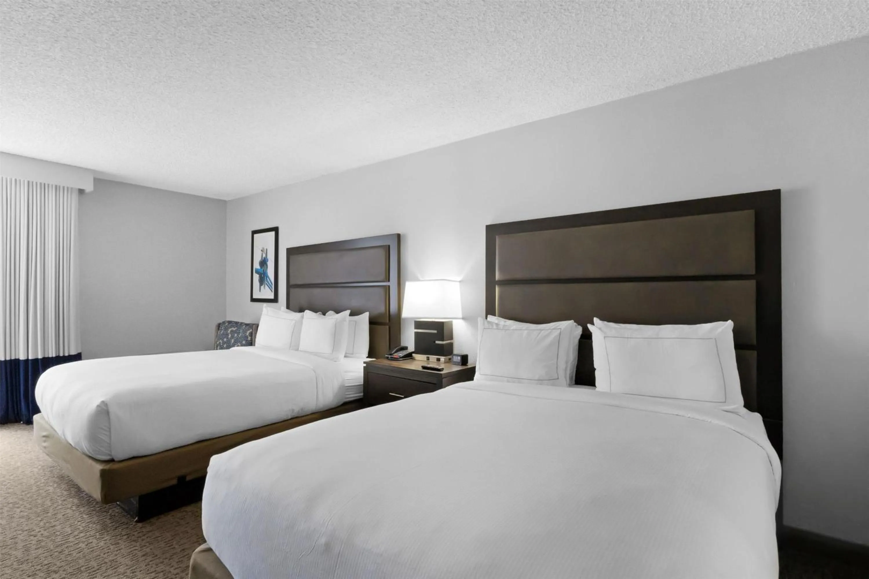 Queen Room with Two Queen Beds and Garden View in DoubleTree by Hilton Palm Beach Gardens